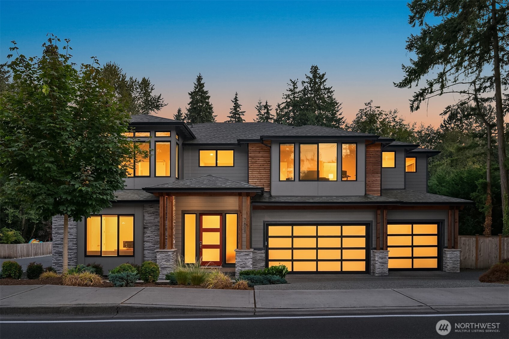 Built in 2021, this contemporary home showcases an open layout with year-round natural light. Walk inside to your chef’s kitchen offering dual pantries, waterfall quartz countertops, an oversized island, high-end stainless steel appliances, 60” fridge, and white shaker cabinetry. With 4 bedrooms, 3.5 baths—including 2 en-suites—plus an office and bonus retreat, there’s space for every need. The primary suite features a flex space, large spa-like bath, and expansive walk-in closet, while the great room opens to a covered patio with a cozy outdoor fireplace. Additional features include a 3-car garage, mudroom, and central A/C - all within top-rated Northshore School District on nearly a third of an acre. This one is a must-see!