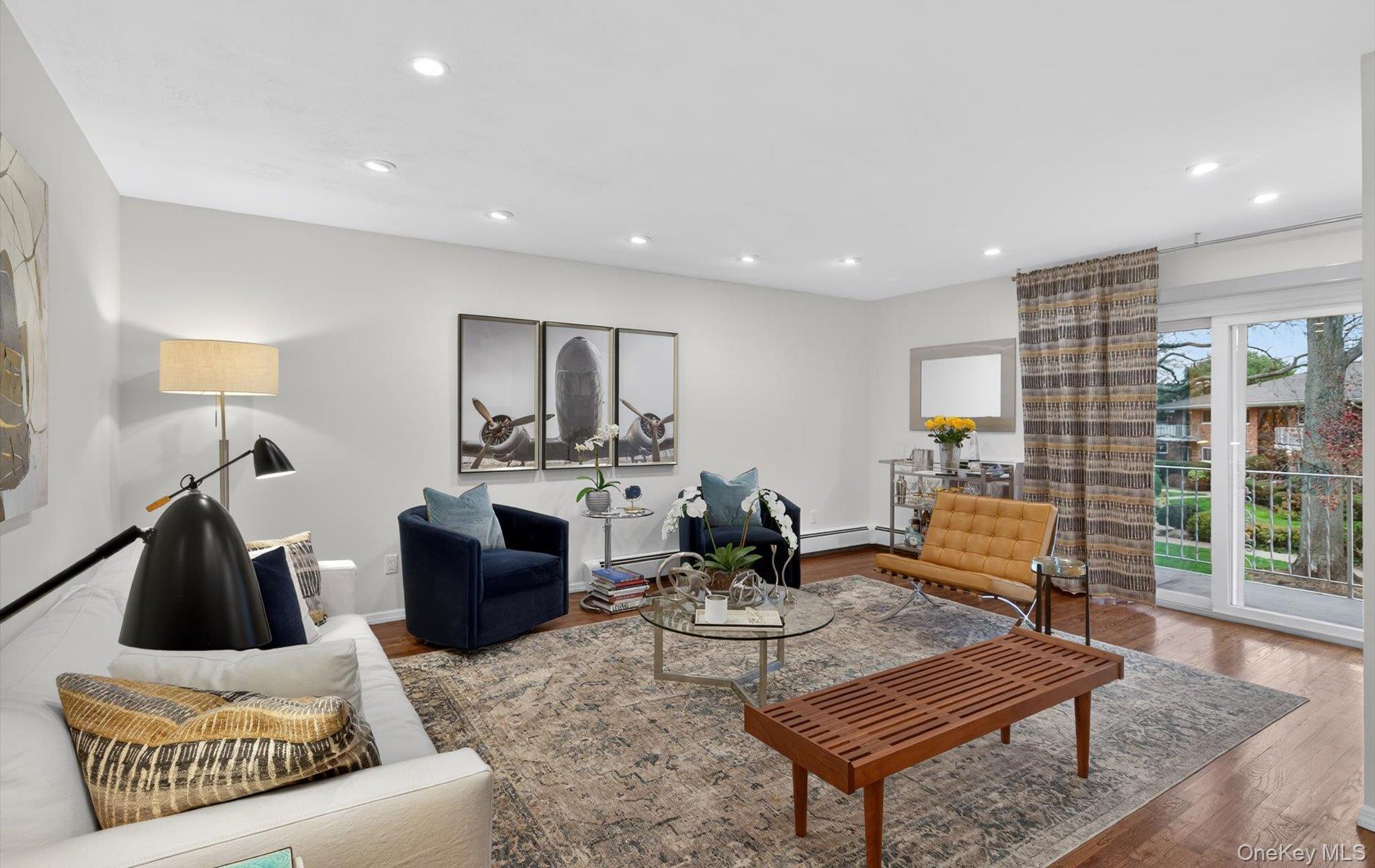 A rare offering at Toms Point: this beautifully updated 2-bedroom, 1-bath corner unit is in excellent, move-in condition. The moment you step inside, the home impresses with its beautifully flowing floor plan and effortlessly inviting atmosphere.The spa-like 2023 bathroom renovation with a waterfall shower and the updated kitchen with granite countertops and stainless-steel appliances are standout features of this light-filled residence on the second (top) floor. It also offers gleaming hardwood floors, abundant custom closets, beautiful custom window treatments in both bedrooms, and a private balcony overlooking the lush, meticulously landscaped courtyard.Residents enjoy exceptional waterfront amenities, including an in-ground pool, private beach access, kayak storage, mooring rights, bike storage, laundry rooms, and front gate attendant providing added peace of mind. The grounds feature a scenic bayfront promenade perfect for relaxing walks and unforgettable sunsets.Commuting is effortless with a 36-minute LIRR express train into Manhattan. All this within a vibrant town known for its exceptional shopping, dining, and cultural amenities.Beautifully maintained, wonderfully located, and rarely available — this home is a must-see. Please note new insulated roof (2024).