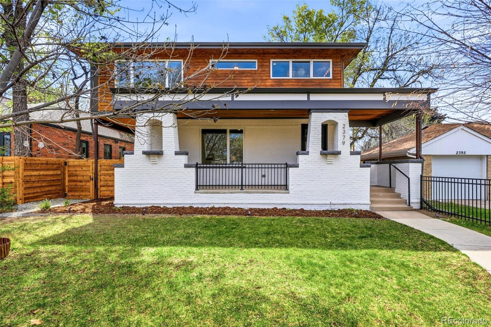 Welcome to 2379 Ivanhoe - where modern design meets the timeless charm of South Park Hill. Thoughtfully reimagined with a pop-top full renovation in 2016, this home has also undergone a top-to-bottom refresh this year. Offering a truly turnkey experience with elevated finishes throughout...all that's left to do is move in! Step inside to an open, light-filled layout where exposed brick and refinished hardwood floors create warmth and character. The living space was designed for connection and entertaining, featuring a dramatic overhead garage-style door that opens seamlessly to a covered patio - blurring the line between indoor and outdoor living. At the heart of the home, the gourmet kitchen impresses with sleek European cabinetry, an oversized quarz countertop island, Electrolux appliances, and a MASSIVE walk-in pantry that is as functional as it is rare. Upstairs, the generously sized primary suite is a true retreat with dual walk-in closets and a completely refreshed spa-like bath, including a freestanding soaking tub, dual-head shower, and brand new oversized quartz vanity. Each secondary bedroom features its own en-suite full bathrooms. Plus you'll find a versatile loft space perfect for work or play. The fully finished, high-ceiling basement expands your living space with a cozy media area and wet bar - ideal for movie nights or hosting. Recent updates in 2026 include all new bathrooms, fresh interior and exterior paint, new carpet, refinished hardwood floors, refreshed landscaping, and new cedar privacy fence in back and iron fencing enclosing the front. Dual HVAC units with whole house humidifiers and UV disinfection systems add comfort and peace of mind. A rare find in South Park Hill - the attached 2-car garage is a standout with high ceilings, car lift (negotiable), tile flooring, speaker system, split HVAC, and R30 grade insulation. All just moments from Park Hill’s favorite shops, restaurants, and parkways - this is the one that truly checks every box.