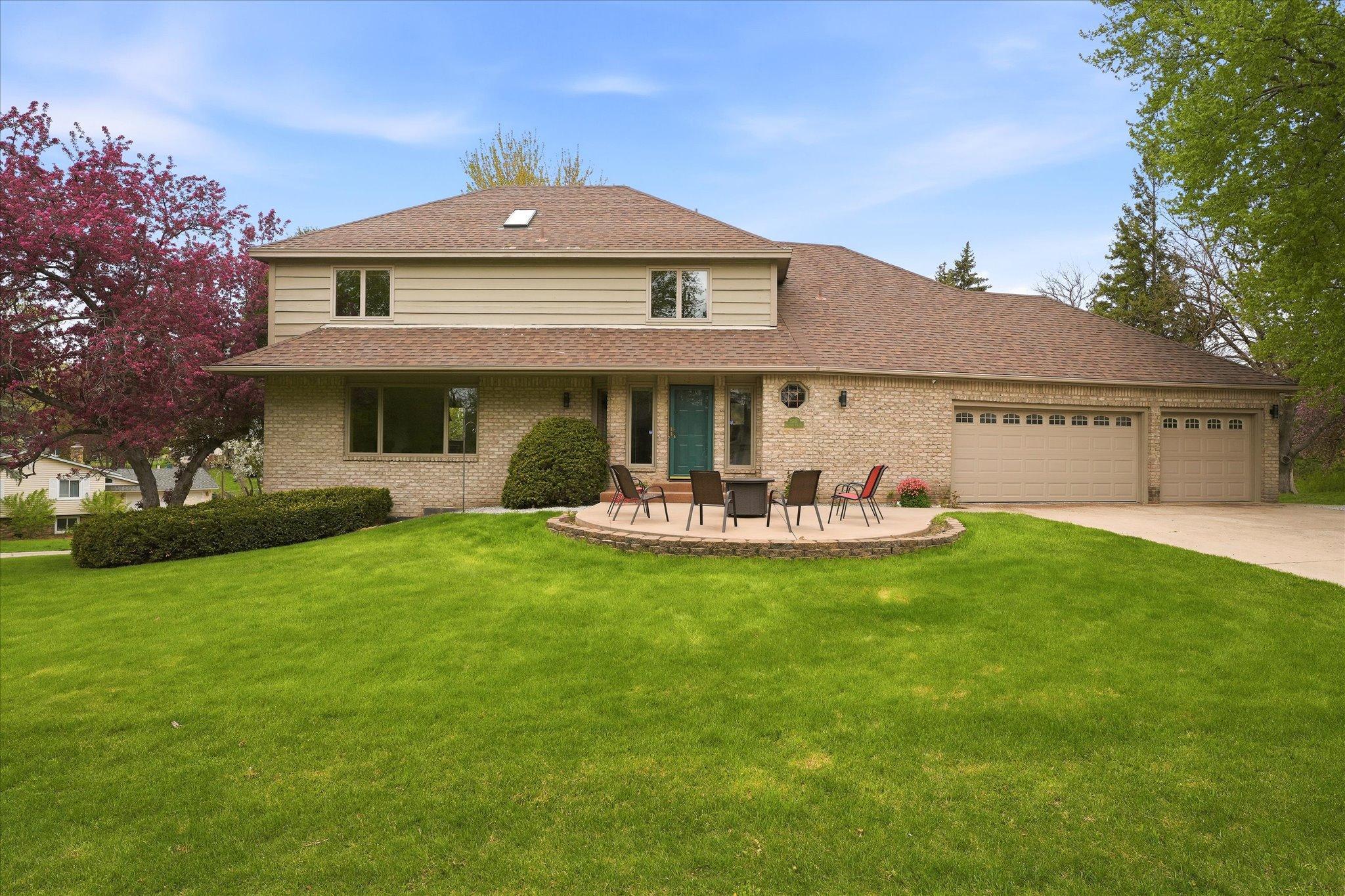 Well-designed and custom built, this impressive 4,000-square-foot home offers exceptional space, comfort, and an unbeatable location in an established neighborhood.A welcoming front patio sets the tone, leading into a sun-filled interior designed for both everyday living and effortless entertaining. With a spacious living room, large kitchen, two family rooms, a bonus room, two expansive decks, and a walkout lower level, there’s plenty of room for everyone to gather or spread out, great option for multi-generational living.The upper-level features three bedrooms on one level, including a large primary suite with a beautifully updated bath featuring heated floors, a luxurious 6-foot soaking tub beneath a skylight, a separate walk-in shower, and an oversized custom walk-in closet with exceptional storage. At the heart of the home is the sunken family room just off the kitchen, where a dramatic floor-to-ceiling brick fireplace creates a warm and inviting focal point for family gatherings and entertaining.Everyday convenience is enhanced by the attached three-car garage, which opens into an oversized mudroom with a main-level laundry area, 3 temp zones one for each level, and abundant storage.Outside, you’ll appreciate the beautifully landscaped yard, durable Hardie® siding, a roof that’s only 10 years old, and a full in-ground sprinkler system for easy maintenance.Nestled on a quiet cul-de-sac street surrounded by mature trees and just minutes from parks, restaurants, and shopping, this exceptional home combines timeless design, generous living spaces, and an outstanding location—ready to welcome its next owners.