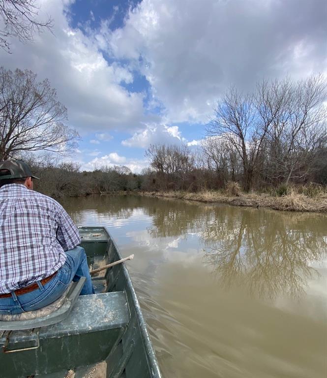 Launch your small boat from the bank of your land and take Big Creek right out into Lake Limestone, or fish from the creek! You can also launch your big fishing or ski boat at Lake Limestone, just minutes away, for all the water sports! If you enjoy hunting, this land is ideal for deer, duck, hog and varmint hunting. The land is gorgeous, rolling, sandy soil and has abundant mature hardwood trees! Perfect for walking or riding trails! AG exempt for lower taxes.  Located about 10 minutes from the small town of Groesbeck and convenient to the I-45 corridor. Enjoy your own paradise and bring a nice RV or build a cabin or home, the electricity is at the road in front of your land! Call now to schedule a showing!