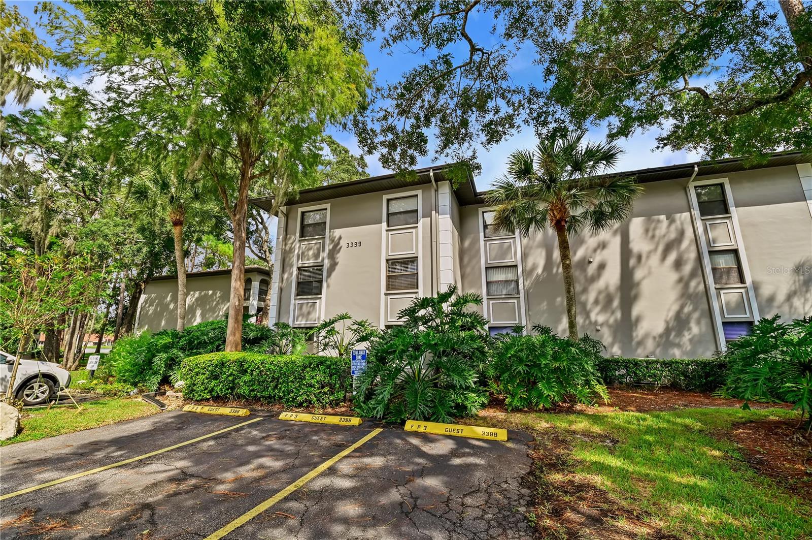 Virtually staged. Welcome to 3399 Mermoor Drive #210 in the beautiful Ridgemoor community in the desirable East Lake area of Palm Harbor! Nestled in a peaceful, park-like setting, this well-maintained condo offers 2 bedrooms, 1 bathroom, and a spacious, private screened-in balcony overlooking the beautifully landscaped courtyard—perfect for enjoying your morning coffee or relaxing in the evening. The kitchen overlooks the living area, creating an open, comfortable feel. The stackable washer and dryer were replaced in 2025, and the water heater was replaced in 2024. A storage unit is conveniently located next to the covered parking space.This pet-friendly community allows one pet under 25 lbs. Amenities include a heated, screened-in pool with covered seating and restrooms, a gated entrance, and a car wash station. The Ridgemoor master association also offers tennis and basketball courts, a playground, and scenic walking and biking trails. Monthly condo fees include water, sewer, trash, basic cable TV, pool maintenance, building insurance, grounds maintenance, reserves, gated security, and recreational facilities. The roof was replaced in 2021 for added peace of mind.Enjoy a convenient location just minutes from the YMCA, Lansbrook Golf Club, and John Chestnut Park on Lake Tarpon, as well as top-rated schools, shopping, and dining. This condo offers a wonderful combination of comfort, convenience, and an active lifestyle. Schedule your showing today!