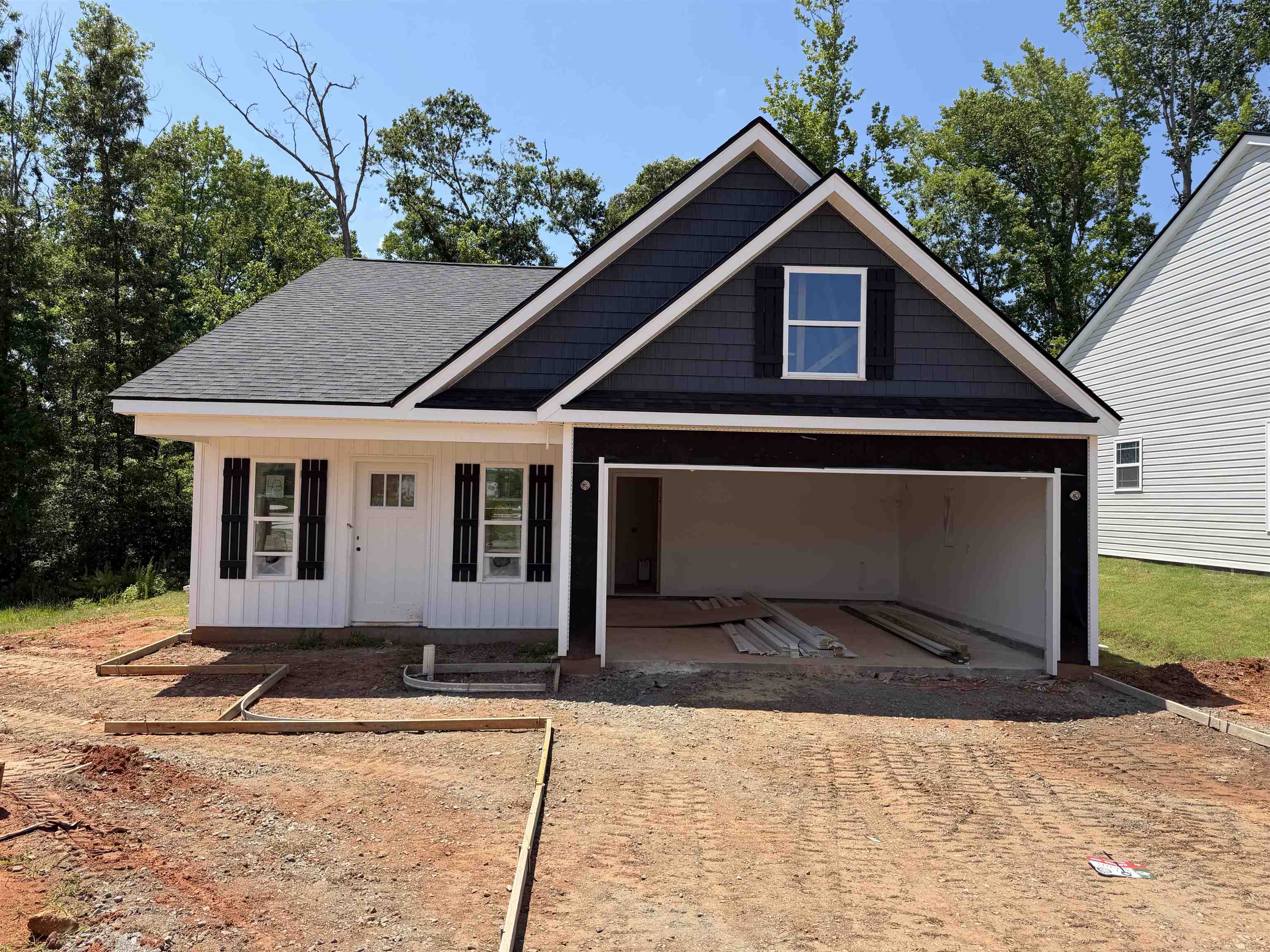 The PACIFIC (Lot 43) offers a modern, open concept living area perfect for entertaining.  3 bedroom, 2 bath. Complete with the trademark chair rail, crown molding, and rope lighting.  12' x 12' uncovered back patio. Upgraded craftsman siding option to include 1/2 stone front porch columns.  30-year architectural shingles, site-built construction, and a 10 year limited warranty are included to give you peace of mind.  Home is at the end of the road in a half cul-de-sac for added privacy. Only one side will have neighbor. Preferred Lender/Attorney Closing Costs Incentive Offered!  *Virtual tour reflects same house plan, not exact house.