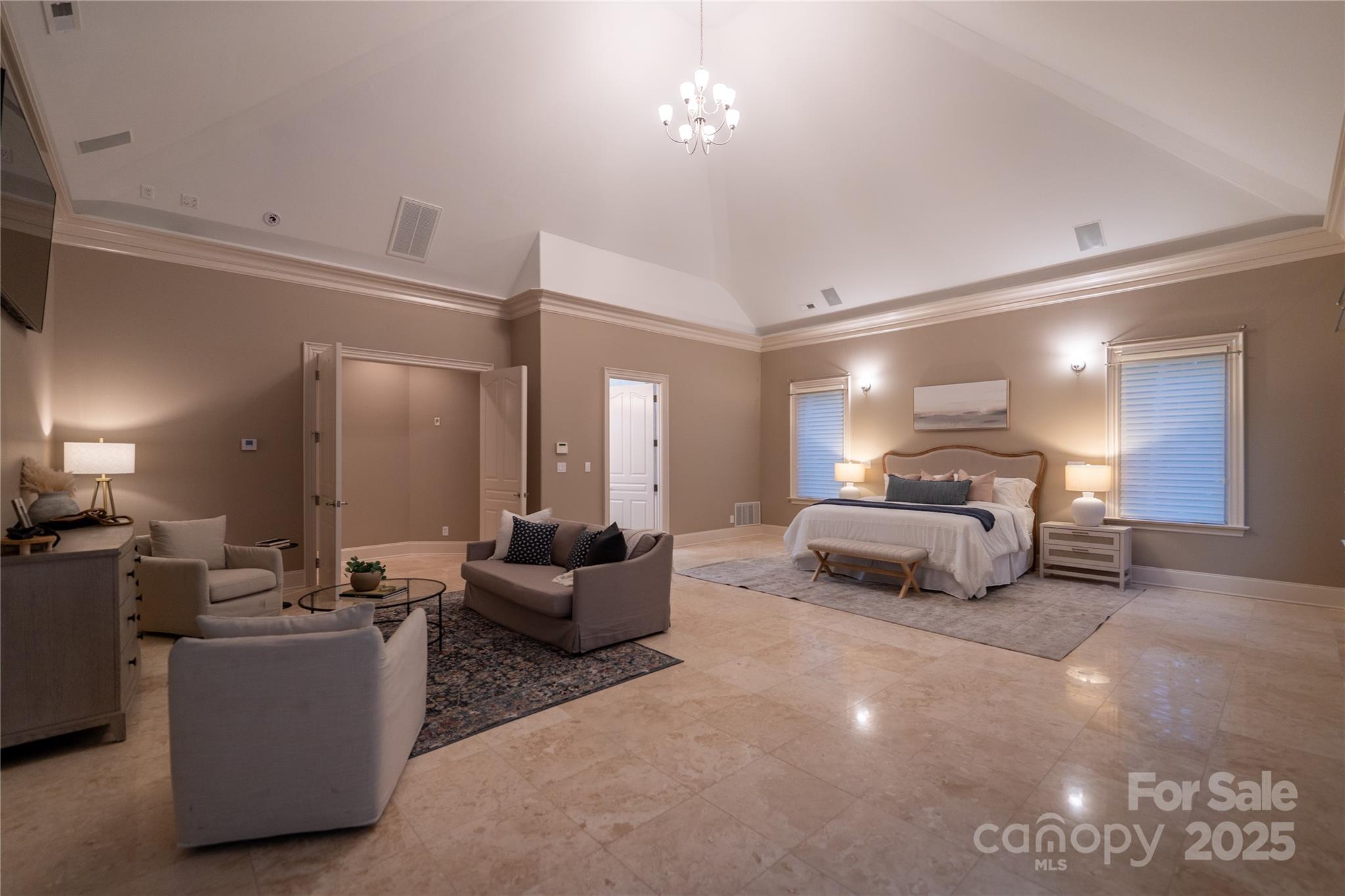 This spectacular 10,144 square foot waterfront home has a private boat dock and indoor pool/spa. If you're looking for a private retreat in an exclusive community, this is the home for you.
Nestled on the shores of Badin Lake with over 200 feet of private shoreline, this premier waterfront retreat offers captivating lake views and effortless lake living. Just steps from the renowned Old North State Club, ranked among Golf Digest’s top courses, the property features a lighted dock with a boat lift and three Jet Ski lifts. An exceptional indoor pool retreat awaits with travertine floors, cedar storage, dry sauna, stone fireplace, and hot tub, designed for year-round enjoyment in a peaceful setting. Four on-suite bedrooms, with a huge primary suite. Two full kitchens(main level and basement) with a dumbwaiter for effortless connection. Updated appliances. New dehumidifer in the pool/spa. Four A/C units were replaced in 2020. Other standout features include, Sonos Sound System and HikVision security system to name a few. Please see the attached features list for more details. The home is located in the gated community of Heron Bay.