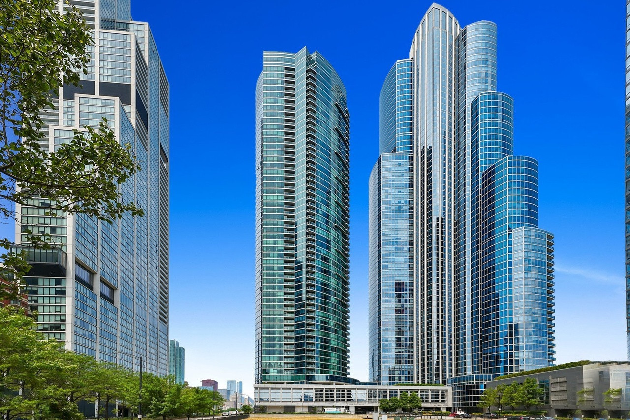 This luxurious condo located at 1201 S Prairie Ave in Chicago, IL offers the epitome of modern city living. Conveniently located at the southend of Grant Park in Chicago's South Loop neighborhood, this condo is just steps from Chicago's famous museum campus, Soldier Field, numerous restaurants and commercial retailers, and the beautiful shores of Lake Michigan. As you step inside this stunning condo, you'll instantly notice the spectacular unobstructed views. Relax on your private balcony and enjoy panoramic views of Lake Michigan, Navy Pier, Millennium Park, and the spectacular Chicago skyline. Boasting a sleek and contemporary design, this 2 bed, 2 bath, PLUS den offers high-end custom finishes throughout. The modern deluxe chef's kitchen features white lacquer cabinets, quartz counters, under cabinet lighting, and high end appliances including Sub-Zero fridge, Bosch dishwasher, and Wolf range. The large primary suite features a custom-designed walk-in closet complete with built-in jewelry and laundry storage. Both the primary and second bedrooms feature custom wall coverings and remote controlled, motorized blackout shades. Moving into the spacious living room plus den, you'll find a sleek entertainment/media center along with a custom-built Subzero Wine Column fridge that holds 110bottles. Unit features designer lighting, California closets, wide-plank walnut flooring, and full size stackable washer/dryer. Floor to ceiling windows throughout allow plenty of natural light to flood the space, creating a warm and inviting atmosphere Premium heated garage space INCLUDED in price!Five star amenity building offers 24 hour door staff, concierge, indoor pool, gym, sundeck, lounge, catering kitchen, children's playroom, theater and more!