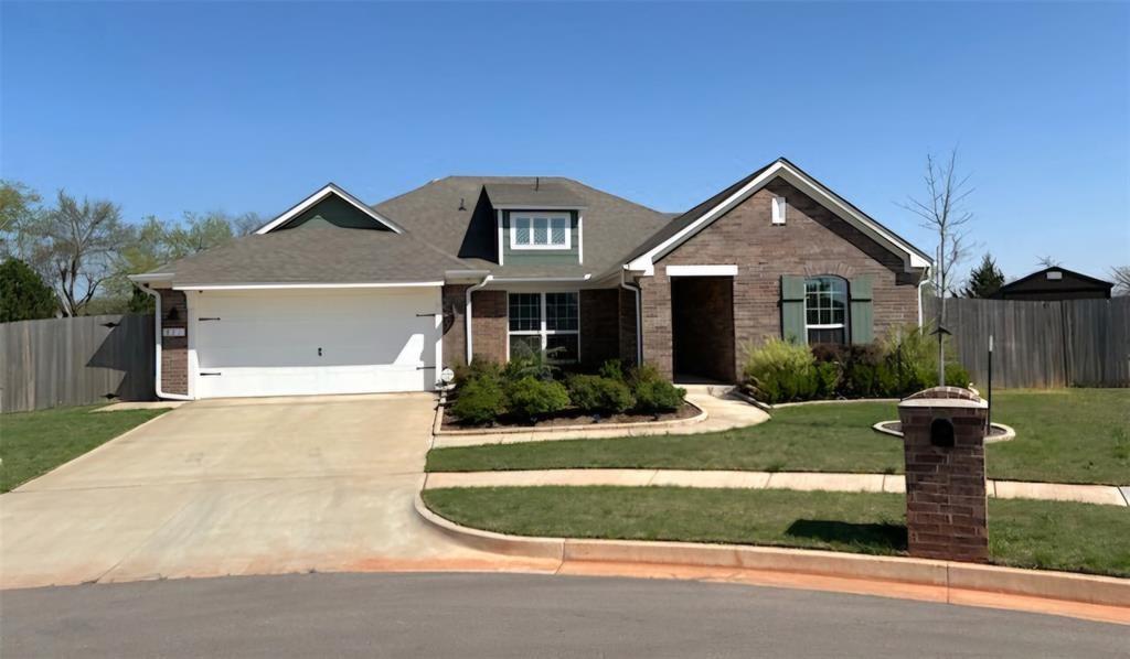You will love the open layout, large family room and kitchen that was designed for entertaining. The living room features a cathedral ceiling with a wooden beam, lovely fireplace and beautiful wood flooring in entire house. The kitchen is a chef's dream, with stainless steel built in appliances with a gas range, elegant granite countertops and white cabinetry. The primary bedroom features vaulted ceilings, a large walk in closet, and an ensuite with a relaxing soaking tub, dual sink vanity and a shower. The two car garage has a tornado shelter. Furniture, a modern fridge, washer and dryer are included in a price! You will be pleasantly surprised to see a spacious backyard with many fruit trees. Full gutters are installed around the exterior, ensuring practicality and ease of maintenance. Residents of Red Canyon Ranch love the convenient location close to the University of Oklahoma and I-35. Red Canyon Ranch features scenic views, rolling hills, a playground, and peaceful walking trails surrounded by Norman's unique landscape.