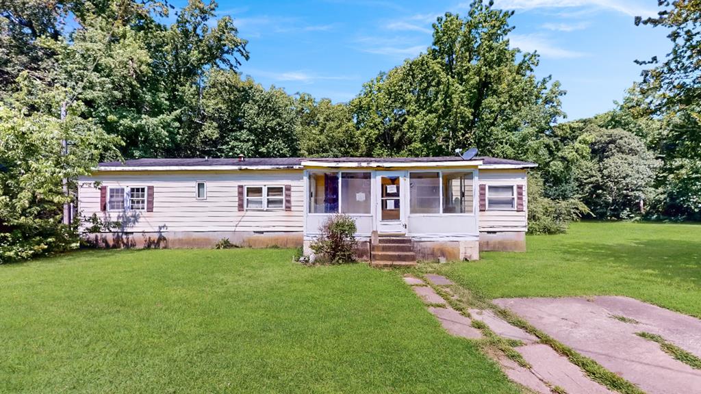 Located off of Lankford Highway less than 10 minutes from the Chesapeake Bay Bridge Tunnel. This 3-bedroom double wide home has 2 full bathrooms, large living room, large dining room, den/office space, large kitchen, laundry area and front porch / sunroom.  Only about a 10-to-15-minute drive to the town of Cape Charles and Kiptopeke State Park. Make sure to ask about the 3D True Immersive Virtual Tour. This technology allows you to literally experience the home on any mobile device, laptop or desktop. You can measure rooms, view 3D dollhouse, view exterior, and interior and so much more. Check it out today!