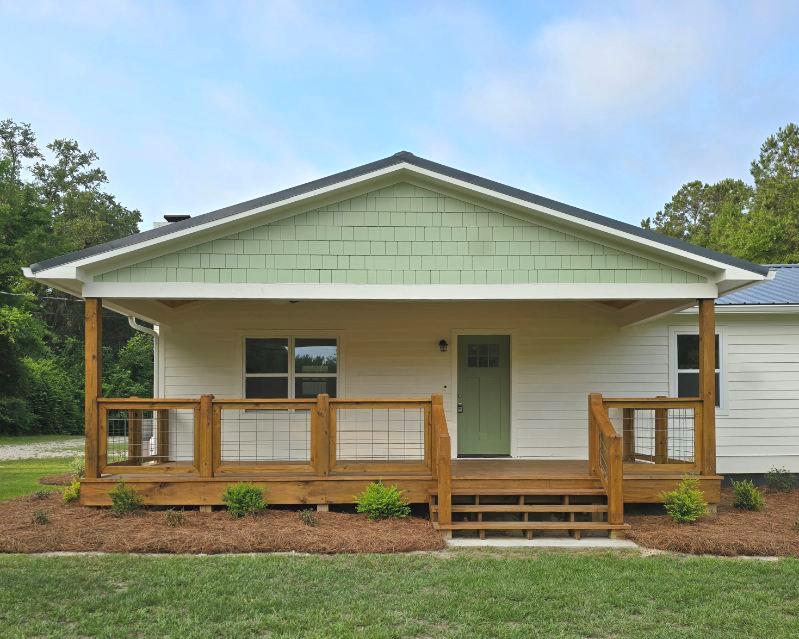 Charming 10-Acre Homestead with Two Beautiful Homes, Shop & Stocked Pond! Welcome to your own private retreat! Nestled on 10 peaceful acres, this fully remodeled property offers the perfect blend of modern comfort and country living. The main home features 4 bedrooms and 2 bathrooms, boasting spacious living areas, updated finishes, and plenty of natural light. Just steps away, the second home is a 3 bedroom, 2 bathroom residence with 1,152 sq. ft., ideal for extended family, guests, or potential rental income. Enjoy the outdoors with a large shop, perfect for hobbies, equipment, or storage, and a fully stocked pond that's ready for fishing and relaxing. The land offers endless possibilities—gardening, livestock, recreation, or simply soaking in the serene landscape. Two remodeled homes; 10 acres of beautiful land; Shop with ample space for projects or storage; Stocked pond for fishing & fun; Move-in ready and meticulously maintained; Don't miss this rare opportunity to own a multi-home property with space to live, work, and play. Tractor can also be purchased with property! This one has it all! Schedule your private showing today—properties like this don't come along often.