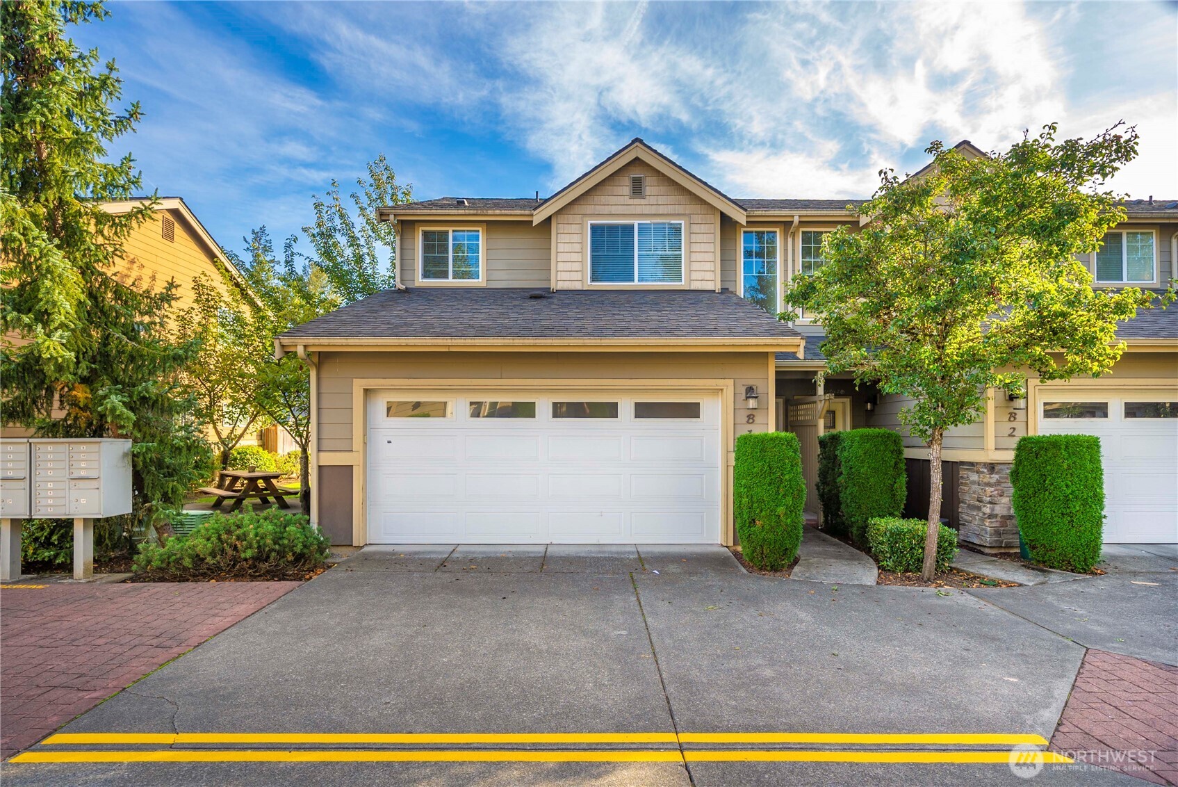 Welcome to this beautiful end-unit townhouse in the desirable Maplewood Grove gated community! This two-story home features 3 bedrooms, 2.5 bathrooms and 1,849 sq. ft. of comfortable living space. The open-concept layout offers a spacious and inviting atmosphere with vaulted ceilings, a large kitchen with granite countertops and a breakfast island, and laminate flooring throughout the main level. The bright living and dining area includes a large sliding door that opens to the back patio and a fully fenced backyard. All appliances are included. The attached 2-car garage offers convenience and extra storage. Ideally located close to freeways, Kent Station, shopping, dining, parks, and public transit. Must see!