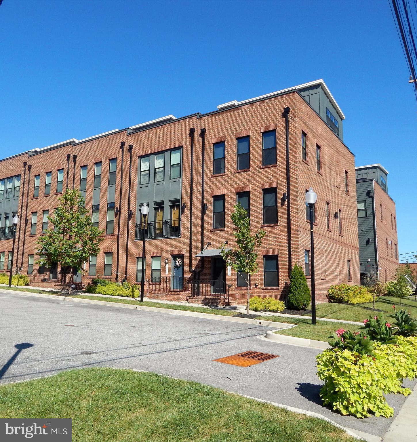 4010 Harmony Court is an elegant 3 bedroom, 3.5 bath, well maintained, end-unit townhome in the heart of Brewers Hill. With over 2,200 sq feet of finished living space and an open concept floor plan that provides more living options than some single-family homes.Amenities include wide plank hardwood flooring, oak foyer stairs, craftsman 3-panel interior doors and designer lighting throughout.  For the chef, Frigidaire stainless-steel appliances, gourmet kitchen island, granite countertops and 42” Timberlake cabinets for ample storage. The 9-foot ceilings, high performance PlyGem Low “E” black vinyl windows and convenient upper-level laundry room simply add to the beauty and usefulness of this space.This floorplan includes two large primary bedrooms.  Both of which include deluxe en suites with oversized showers, hand-set ceramic tile flooring, cultured marble raised vanities and walk-in closets. The 3rd bedroom on the entry level also has a deluxe full bath which makes this the perfect opportunity for a guest suite or your very own private study/office away from the main living areas. The fourth level is an entertainer’s dream with a nice lounge area and two rooftop terraces.  A convenient powder room is also located on this level.This community has walkable access to a variety of restaurants, grocery stores (Harris Teeter and Sprouts), shopping in Canton Crossing, entertainment & fitness centers.  Canton Waterfront Park is also within walking distance.  Conveniently located near several medical facilities including Johns Hopkins Bayview, Mercy Medical Center and Medstar Harbor which is perfect for medical professionals who prefer an easy commute. Schedule your appointment today!