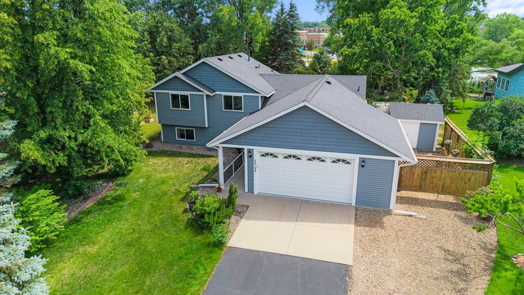 Beautifully maintained 4-bedroom, 3-bathroom home in a desirable Savage neighborhood. Comfortable, thoughtful updates, and a peaceful setting! Close to shopping, parks, and Glendale Elementary School, yet surrounded by mature trees and backyard privacy.Vaulted ceilings, abundant natural light, and warm wood flooring throughout main level. Kitchen with center island, built-in desk/drop zone, and breakfast nook, flowing into the spacious living area with 11-ft ceilings, bay windows, formal dining, and deck access.The upper level includes a private primary suite with 3/4 ensuite, two additional bedrooms, and a shared full bath. The finished lower level extends living space with family room, fourth bedroom, 3/4 bathroom, and finished laundry space.Private backyard retreat with gardens, stepping stone pathways, maintenance-free deck, patio, storage shed, and trailer or small boat parking. Oversized, attached 2-car garage! Recent updates including windows, siding, gutters, roof (2019), and epoxy garage flooring (2026) add peace of mind.