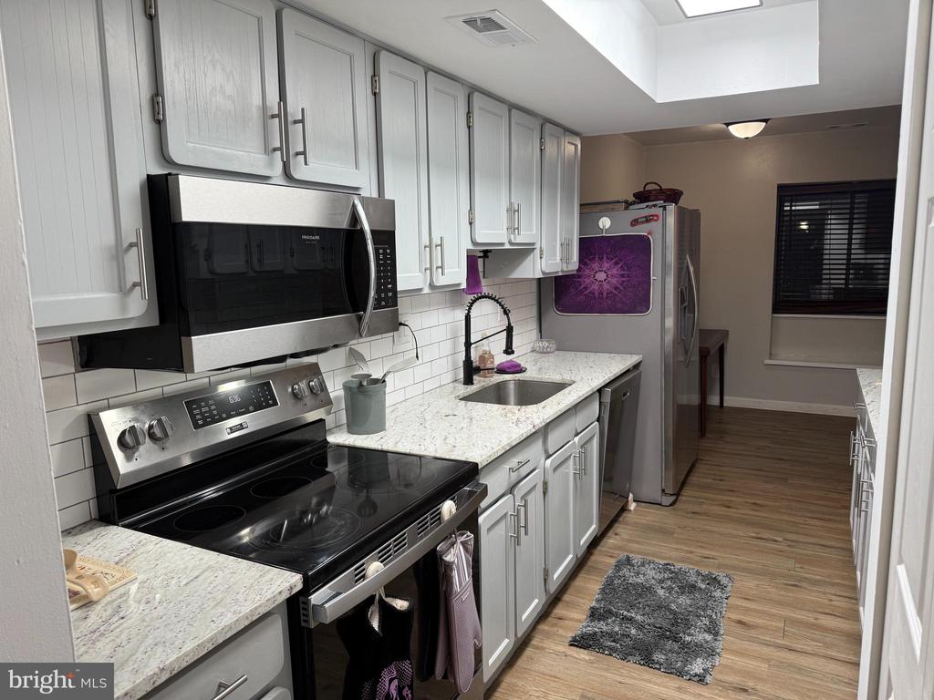 Welcome to this charming 3-bedroom townhouse offering comfort, convenience, and a true sense of home. Inside, you’ll find a bright and inviting main level featuring a well-appointed kitchen with granite countertops, stainless steel appliances, and plenty of cabinet space.The home includes 1 full bathroom and 1 half bathroom, offering practicality for both daily living and hosting guests. Each bedroom is generously sized, providing flexibility for sleeping, office space, or hobbies.Step outside and enjoy the peaceful backyard that backs to a wooded area, adding privacy and a beautiful natural backdrop throughout the year.Located in a vibrant, amenity-rich community, you’ll have access to dog-friendly walking paths, biking trails, kayaking areas, and a refreshing swimming pool. This townhouse blends comfort, nature, and active living—ready to welcome you home!