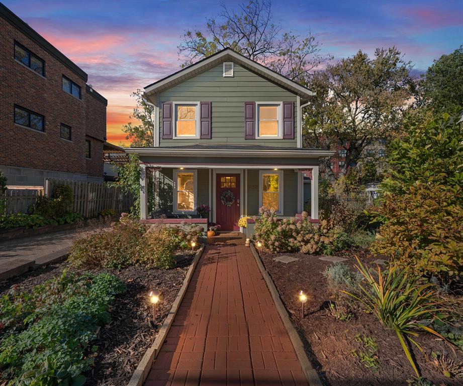 Nestled between Water Hill & Kerrytown, this 2 story home has 3 bedrooms, 2 full baths, the character of a historic home, & many modern updates & conveniences. 1314 sq ft with open floor plan, living room w/cherry floors, fireplace & eat-in dining space. Bright kitchen with plenty of granite counter space & cabinets for storage. Bedroom & full bath located on entry level. Upstairs is the primary bedroom with vaulted ceilings, a sliding glass door to private balcony with access to deck and backyard below via spiral staircase. Rare second floor laundry. Nice large lot with a fenced in backyard and deck plus plenty of outdoor space. Entertain fireside! This River Safe Home has 7kW solar panels, newer: siding, windows, sewer and water lines. Detached 1.5 car garage wired for EV with room for bikes, kayaks or storage. Located 1 block from all that is special about Ann Arbor with a Walk Score of 97, near Kerrytown, the Farmer's Market, B2B Trail & the vibrant pulse of downtown. HERD Score 6