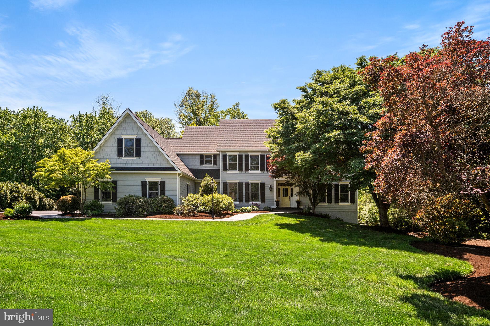 Welcome to 3 Greenstone Way in Malvern, a beautifully maintained and thoughtfully updated 5-bedroom, 4.5-bath Colonial with a classic James Hardie Plank exterior (2021), set on a serene 1.2-acre cul-de-sac lot in Willistown Township, just under two miles from the towns of Malvern and Paoli. A welcoming two-story Foyer with refinished hardwood floors and a sweeping turned staircase introduces the home’s timeless elegance. The main level features a refined Living Room with front-to-back exposure and gas fireplace, a gracious Dining Room with wainscoting and elegant lighting ideal for entertaining, and a custom Office with built-in cabinetry creating a quiet and functional workspace.The Eat-In Kitchen blends style and functionality with refinished hardwood floors, wood and glass-front cabinetry, a center island with quartz countertops, double ovens, and new appliances (2025). The Kitchen flows seamlessly into the Family Room, highlighted by a stone wood-burning fireplace, cathedral ceiling, custom built-ins, and expansive windows overlooking the backyard. A bright Three Seasons Sunroom extends the living space and opens to an oversized deck and pool, perfect for indoor-outdoor living. Completing the main level are a conveniently located Powder Room, a large Mudroom with garage access, and a sun-filled first-floor Laundry Room.Upstairs, the spacious Primary Suite offers abundant natural light, a tray ceiling, private sitting room, outfitted walk-in closet, and a beautifully updated Primary Bathroom with new quartz countertops (2026), soaking tub, and walk-in tiled shower. Additional bedrooms include one with an ensuite Bath, two with backyard views, and a well-appointed Hall Bath. The walk-out Lower Level provides excellent flexibility with a light-filled Family Room, a Fifth Bedroom, Full Bath, and additional space ideal for homework, crafting, or hobbies, plus generous unfinished storage with future finishing potential. Outside, enjoy exceptional privacy and outdoor living with a fenced backyard, expansive deck, pool, and room to play, including space for a trampoline, wooden play tower, and a charming chicken coop. Ideally located in the award-winning Great Valley School District and close to top private schools, this home offers a rare blend of space, comfort, and convenience.UPDATES: New Heat/AC in zone 1 (2023), New Roof (2021), New James Hardie Plank exterior (2021), Generator installed (2013), New Heat/AC in zone 2 (2011)