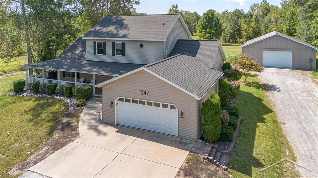 Welcome to this this inviting 2-story home offering 3 bedrooms, 2.5 bathrooms, and 2,688 square feet of comfortable living space, all perfectly set on 18.06 acres of beautifully maintained land just six minutes from downtown Midland. If you've been searching for a property that combines privacy, recreation, and convenience, this one has it all. The land is a true highlight. Nicely manicured trails wind throughout the property, leading you through wooded areas, open food plots, and peaceful spots where wildlife is plentiful. An 8x12 elevated box blind is already in place for hunting, and in the spring you can look forward to hunting for morel mushrooms, which have flourished here for years. Apple trees scattered throughout the acreage add to the charm and provide a natural draw for deer and other wildlife. A separate easement runs parallel to the driveway allowing access to the landlocked parcels behind the property. There's an additional easement that allows access to a neighbor's pole barn on the south side of the driveway.  The home itself is designed with both function and comfort in mind. The main level features a spacious master suite with dual walk-in closets and a private bathroom, offering the perfect retreat at the end of the day. Upstairs, additional bedrooms provide plenty of space for family or guests. The home rests on a 4-foot crawl space with a concrete floor, giving you solid storage and easy access. Thoughtful updates have already been made, including a newer roof, tankless water heater, Trex decking, and railing, all completed about four years ago. Utilities include city water, natural gas, and a septic system that was pumped three years ago. A true bonus is the impressive 40x56 pole barn. Fully insulated, finished with OSB, heated, and equipped with electricity, it features a concrete floor and two 10-foot doors-one at each end-making it incredibly versatile. Whether you're storing equipment, working on projects, or creating a space for hobbies, it's ready to meet your needs. This property offe