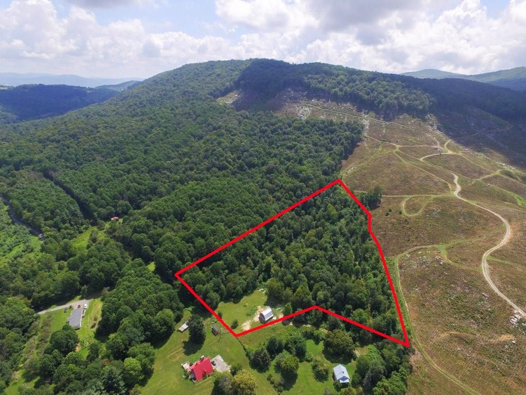 MOTIVATED SELLER on this corner of paradise along the big ridge in Grayson County, VA. This 8.47 acre parcel, bounded by mountain branches and with multiple springs in the area, is mostly wooded and has a load of privacy perfect for the weekend getaway. A barn has been customized to provide a huge bonus to the property for a place to hang out. With additional improvements, this structure could become the gathering space for extended family or friends and even the potential of a lodge for hunting season. With numerous areas for recreation or hunting within the Grayson County area, this landing spot also provides shelter for the recreation toys. The open area includes plenty of parking and playing or relaxing space while watching the wildlife in the area roam the mountain. With a wooded canopy, this parcel provides a habitat of its own, but not just for the wildlife. Pack up the gear and get ready to see what this mountain getaway brings to the table.
