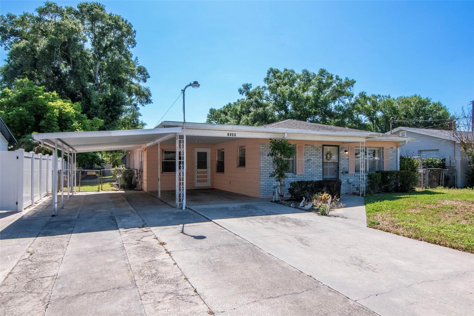 Spacious Home With Flexible Layout in Seminole Heights. This property offers 1831 heated square feet with a total of 3344 permitted square feet, providing extensive space and multiple layout options. The home features two separate entrances, allowing for use as a traditional 3-bedroom, 2-bath residence or the potential to create an in-law suite or separate living area. Two central A/C units support comfortable living and make a multi-unit configuration more convenient. Located in Seminole Heights, the home is within walking distance of ZooTampa, nearby parks, and local amenities. It is situated on a quiet dead-end street and is positioned high and dry in a non-flood zone. With its size, layout, and location, this property offers a range of possibilities for various living arrangements.