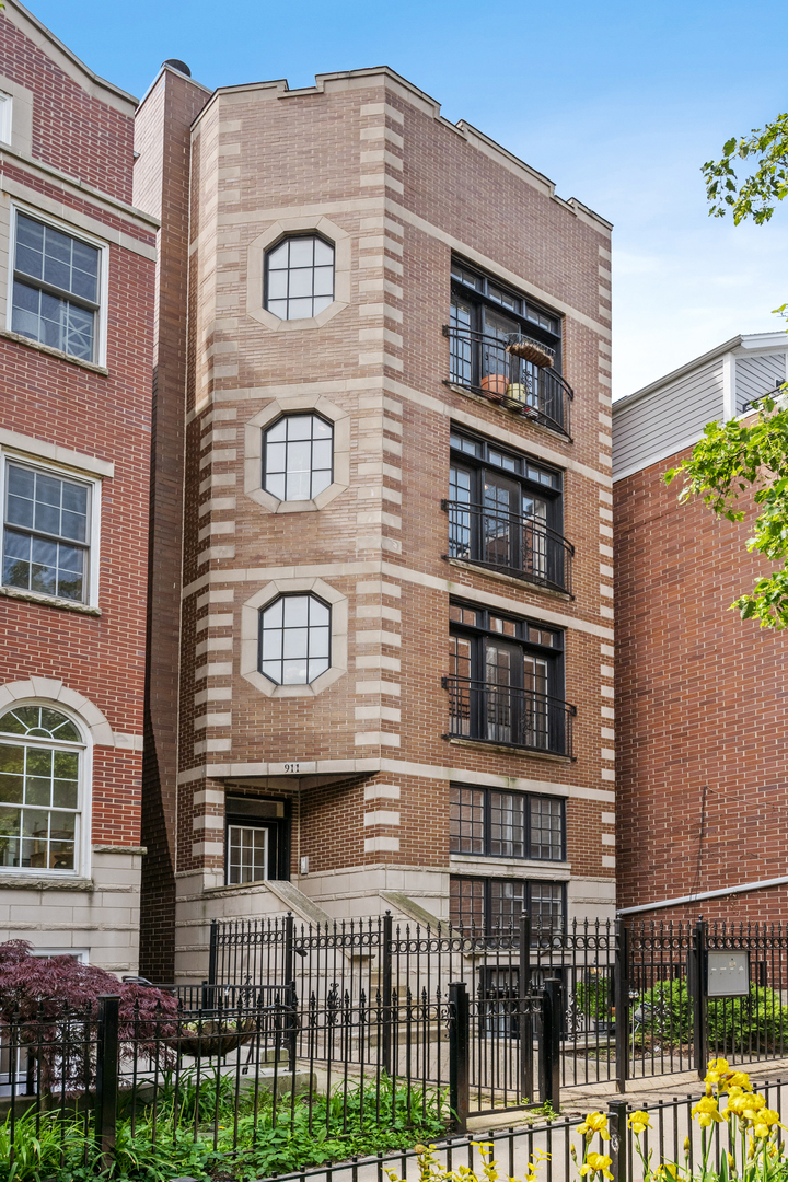 Gorgeous 3BD/3BA Duplex Down in Prime Lakeview/Wrigleyville    Don't miss this beautifully appointed 3-bedroom, 3-bathroom duplex down located in the heart of Lakeview/Wrigleyville. Situated in a rare all-brick 4-unit building built in 2004, this home offers timeless construction, modern upgrades, and an unbeatable location.  Inside, you'll find hardwood floors throughout, detailed crown molding, a gas fireplace anchoring the spacious open-concept living and dining area. The large kitchen is perfect for cooking and entertaining, featuring 42" custom cabinetry, granite countertops w/large island,  and a stainless steel appliance package (2022). Primary and secondary bedrooms located on main level with 2 bathrooms. Primary bath features double vanity, heated floors, separate jacuzzi tub, and steam shower. Lower level consists of secondary living space with additional gas fireplace, 3rd bedroom w/custom built-in Murphy Bed, bathroom with heated floors, and laundry room w/ full size side by side washer/dryer. HVAC system replaced in 2019.  One attached garage parking space included in price along with private storage closet.  Enjoy great outdoor space with a front patio off the lower level and a private rear deck off the primary bedroom.  All of this just steps from Wrigley Field, Southport Corridor, CTA transit, dining, shops, and nightlife. This home combines comfort, style, and convenience - truly a must-see!