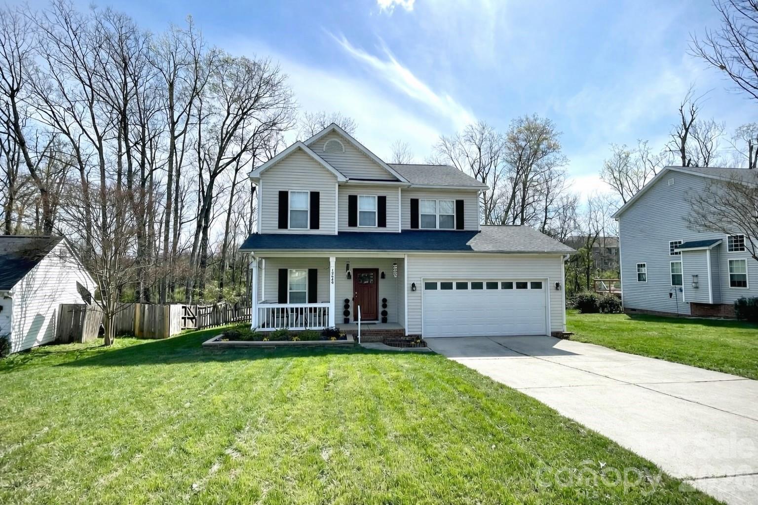 Charming and convenient, all this wonderful Eastfield Ridge home needs is YOU! Step inside to hardwood floors that lead into the inviting family room, complete with crown molding, a cozy gas-log fireplace, and built-in surround sound—perfect for relaxing or entertaining. The kitchen features raised-panel cabinetry, granite countertops, stainless steel appliances, a center island, a pantry, and a sunny breakfast area. The dining room and powder room complete the main level. The upper level includes a laundry room and a stunning hall bath featuring tile flooring, subway tile accents, and a vanity. The spacious primary suite offers a tray ceiling, a private sitting area, and a beautifully appointed ensuite bathroom. Outdoor living is just as appealing, with a welcoming front porch, a rear deck, a paver patio, and a fenced backyard. The "She-Shed" is equipped with electrical power and features front and side entry for use as office space, tool storage, and more. Multiple grocery stores, restaurants, auto service, fitness centers, and medical offices are nearby. Located just minutes away from major highways, I-485, I-85, and I-77. Make your offer soon!