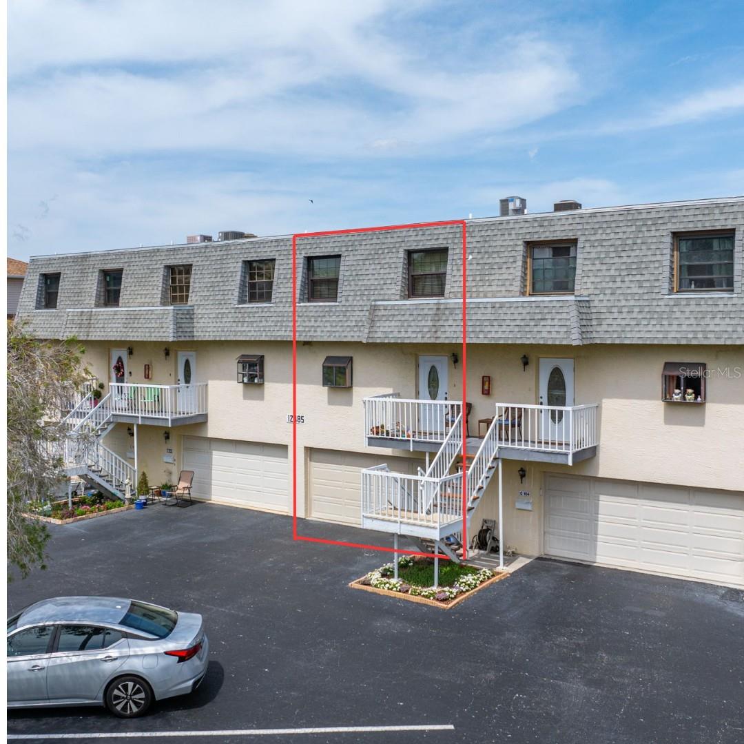 SELLERS OFFERING 6 MONTHS OF HOA FEES PAID AT CLOSING WITH ACCEPTABLE CONTRACT: Enjoy the ocean breeze on Isle of Capri in this meticulously maintained 3 bedroom, 2 1/2 bath condo in Treasure Island! Built as a traditional three-story townhome with no neighbors above or below, this condo is great for entertaining! Boasting over 1,800 sq ft, wide open spaces are waiting for you!  Located on the main floor, the kitchen island will be your friends’ new favorite hangout! The kitchen, dining room, and living room easily flow into each other making this a truly open design.  This floor also has a spacious screened porch for added outdoor enjoyment.  Privacy is at a premium with a split bedroom floor plan.  The primary bedroom is made complete with an ensuite bath with a walk-in shower and skylight.  Bedroom two has a unique element; an in-room vanity with running water!  Perfect for guests or those who need a little extra time in the mornings! All three bedrooms are located on the third floor, as well as the laundry room.   Bath two has recently been remodeled and offers a shower/tub combo. The main level houses a two-car garage and a large bonus room that offers flexibility for storage, a home gym, playroom, or anything else you might imagine!  This home has two HVAC systems (2018 & 2023) for additional comfort.  A short distance from white sandy beaches, restaurants, entertainment and John's Pass Village & Boardwalk where there is shopping, water sports, and much more!  Live in Paradise all year long!  Please visit our virtual tour at https://my.matterport.com/show/?m=8nGjzdgnu7Q