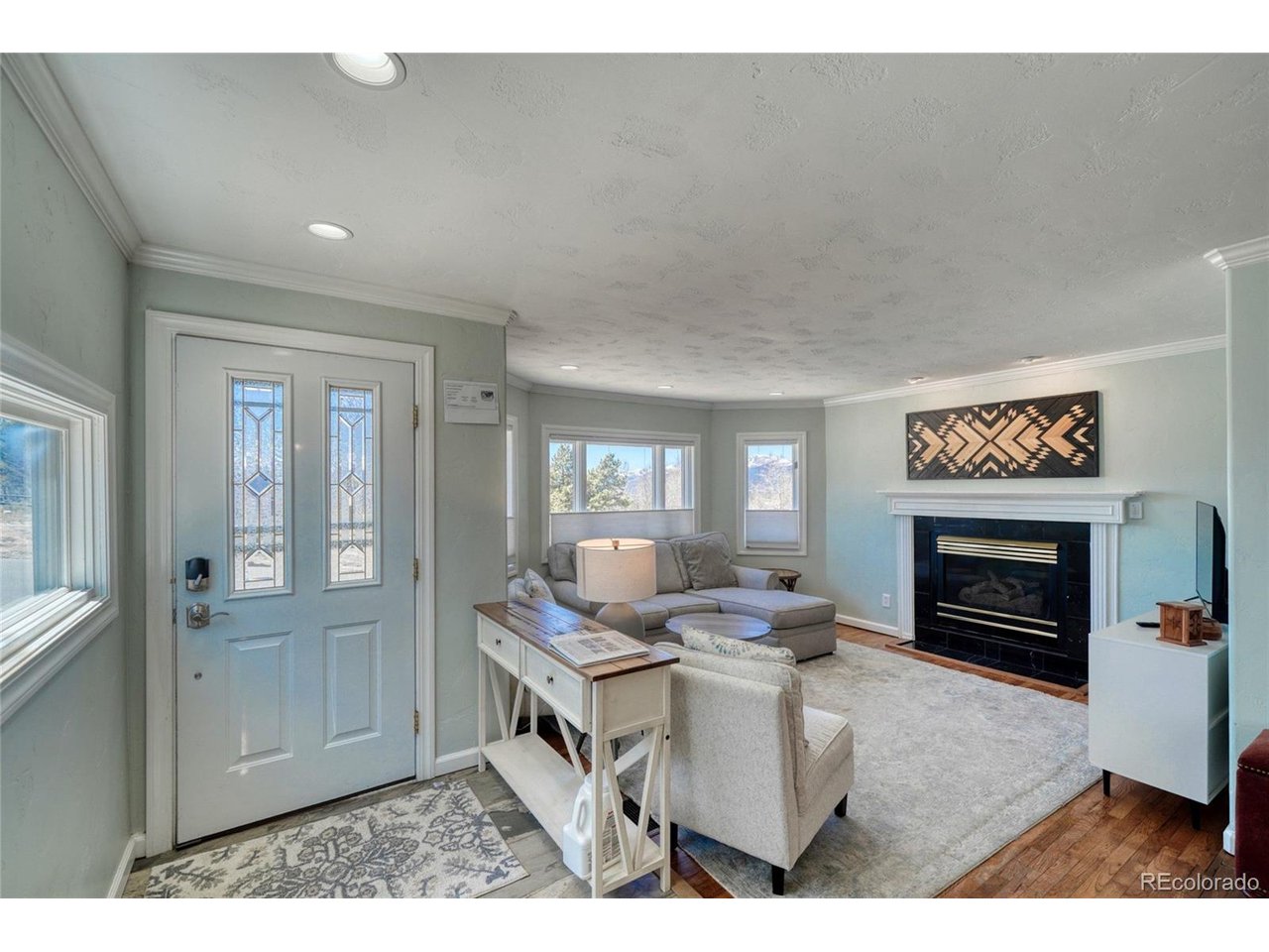 If you've been looking for a home that lets you truly enjoy everything Leadville has to offer, this is it. Located across from the Ice Palace Park with incredible mountain views, this 3-bed, 2-bath home is within walking distance of downtown restaurants, coffee shops, local events & Mineral Belt Trail.The home has been thoughtfully updated over the years while maintaining the character that makes Leadville homes so special. Original hardwood floors have been restored; a gas fireplace insert creates a warm & inviting gathering space & having two full bathrooms adds both convenience & value rarely found in homes of this era. The kitchen features updated tile flooring & newer appliances, while fresh paint & trim throughout give the home a clean, updated feel.The primary suite offers a private retreat with a walk-in closet & tiled bathroom. Two additional bedrooms provide space for guests, or a home office.Outside, you'll find a fully fenced backyard transformed with low-maintenance turf, creating space for pets, entertaining, gardening, or relaxing after a day on the trails. Off-street parking is easy with a concrete driveway, another valuable feature in town.Beyond your doorstep, enjoy easy access to everything that makes Leadville a year-round mountain destination. Explore nearby 14ers, spend the day boating or fishing at Turquoise Lake, raft the Arkansas River, camp under the stars, or enjoy endless opportunities for hiking, biking, ATVing, snowmobiling & skiing throughout Lake County.Major improvements include a newer roof, exterior paint, updated electrical, updated flooring, newer appliances, & a new hot water heater installed in 2026.Whether you're looking for a full-time residence, weekend escape, or investment property, this home is ready to enjoy from day one. Even better, it is being offered fully furnished, allowing the next owner to settle in & start enjoying everything Leadville has to offer.