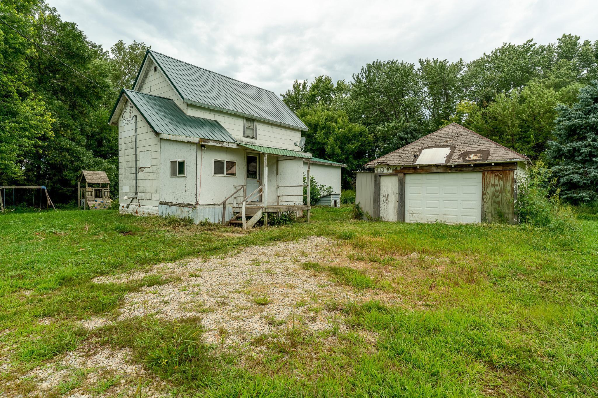 Set on 7 acres just outside Delavan, this property is ready for someone with vision to bring it to life. The home offers 2 official bedrooms plus an additional smaller room ideal for an office or hobby space, a functional floor plan, and a rural setting with open fields and mature trees.

The home is ready for updates and improvements, making it an excellent opportunity to create a customized space that fits your needs. Whether you’re considering a farmhouse renovation, a hobby farm, or a weekend escape, the acreage and location give you a solid starting point.

The land provides room for gardens, animals, or outbuildings, and the location right off Highway 109 offers easy access to Delavan, Blue Earth, and Winnebago.