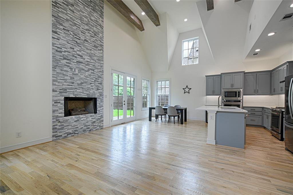 Seller is offering buyer 10k for Buyer to buy down their interest rate! Sophisticated Living Anchored by Historic Views! Experience the perfect harmony of detached single-family living and effortless condominium-style lock and leave convenience in this masterfully upgraded East Dallas home. From the moment you enter, real oak hardwood floors guide you into a luminous, open-concept living area where vaulted ceilings create an airy, grand atmosphere. The thoughtfully designed floor plan centers around a first-floor primary retreat and a quiet, private study perfect for remote work.Culinary enthusiasts will appreciate the beautifully tailored kitchen, hosting top-tier appliances, extensive counter space, and a dedicated wine fridge. However, the true crowning feature lies just beyond the back door. A massive private backyard leads directly to a secure,Up community-owned park, presenting a peaceful backdrop of the stunning, historic Swiss Avenue mansions. With exterior maintenance, landscaping, and utilities seamlessly managed by the association, you are free to simply enjoy the timeless charm of one of Dallas's most coveted neighborhoods.   The Grounds: An expansive, fenced private backyard featuring exclusive gated access to a community park backing up to The SWISS AVE historic estates. The Conveniences: 12 visitor parking spaces, and a full-service HOA covering yard care, sprinklers, water, trash, sewer, and insurance. Right in the middle of it all this home sits just moments from Greenville Avenue, Downtown Lakewood, Uptown and Downtown!