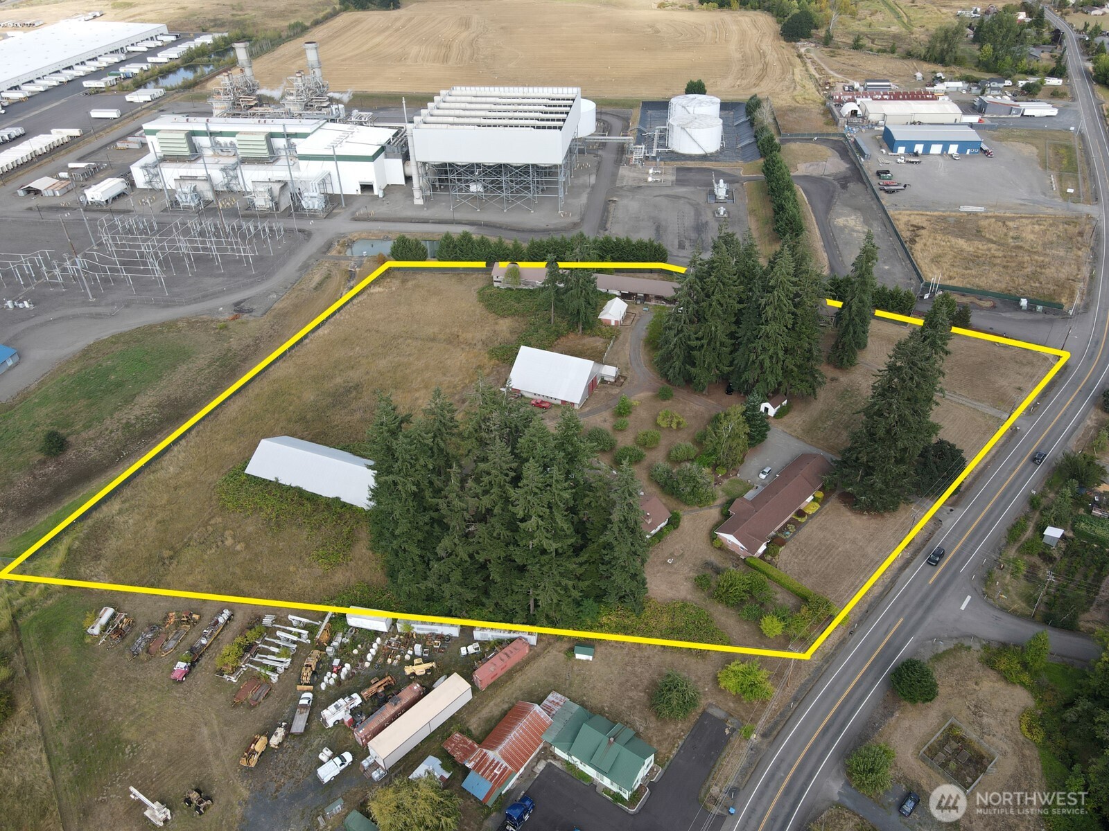 This amazing 7.34 acre 2 tax parcel opportunity is flanked by Port of Chehalis property.  City water and sewer are at the street with septic and well in place.  Currently in the UGA and used as Residential, this unique property provides the perfect transitional footprint for migration to Commercial & Industrial use.  Barns and high capacity outbuildings can provide storage for your heavy equipment this winter as you prep for your final use.  With three current approved living units, your business office and employee/owner quarters could have a great jumpstart.   Create a clean slate for your major undertaking or start by utilizing the seven buildings, one of which has over 16,000 SF on it's own.  Yes, the land alone is less than $4 per SF!