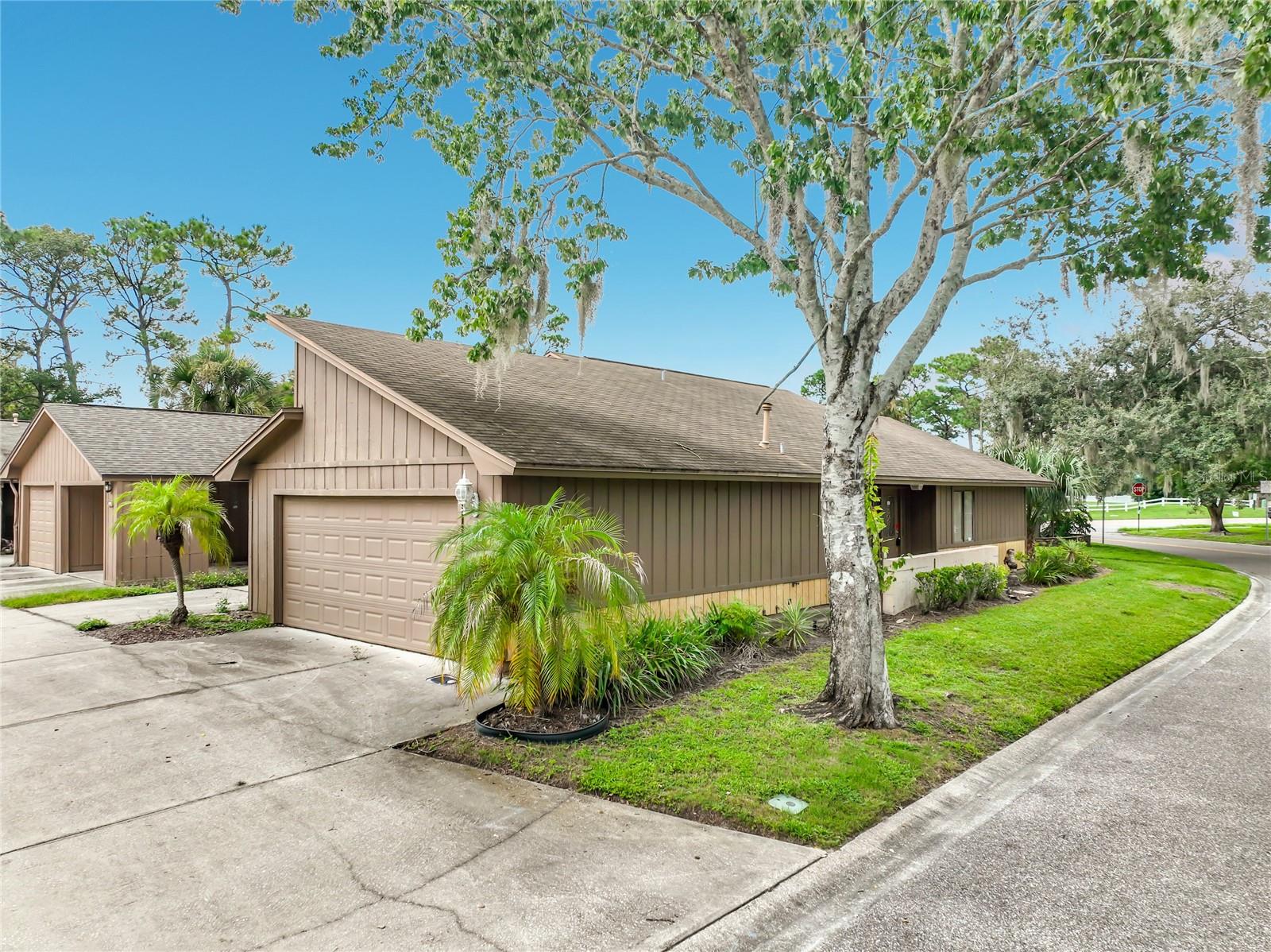 This 3-bedroom, 2-bath corner-unit townhome offers a spacious single-story layout with plenty of room to make it your own. The home features tile flooring throughout much of the living space, high ceilings, ceiling fans, and large windows that bring in plenty of natural light. The kitchen offers plenty of cabinet and counter space along with stainless-steel appliances. The home features spacious bedrooms and separate living and dining areas. Sliding glass doors lead to the outdoor area. The property features a 2-car garage with parking space for up to 3 vehicles. Located in an area zoned for A-rated schools, this home offers plenty of space and a great opportunity for buyers looking to update and add their personal touch.