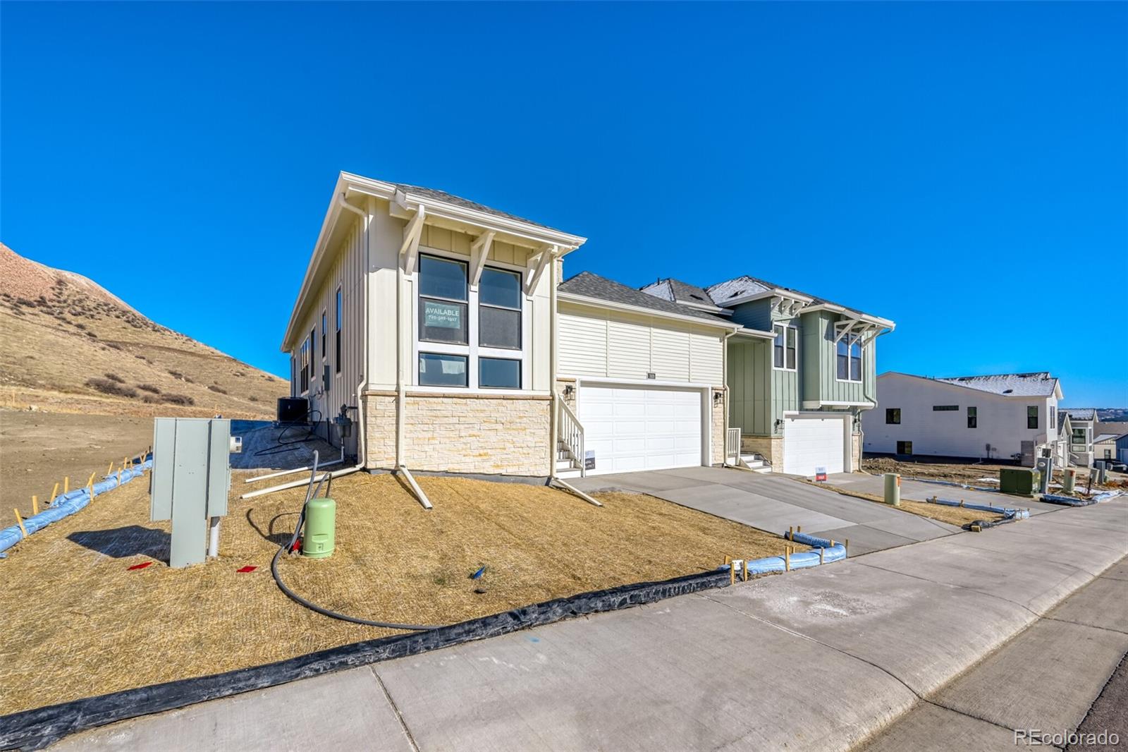 READY NOW! BRAND NEW LOW-MAINTENANCE HOME!  Main level offers 10-ft ceilings with 8-ft doors, main floor office, and covered rear deck.  Design finishes include great room fireplace, Maple cabinetry with dove tail and soft close drawers, tiled kitchen backsplash, KitchenAid® appliances with a gas range & French-door refrigerator, quartz countertops with undermount sinks throughout, 12x24-in bath tile, and luxury EVP flooring.Low-maintenance lock-and-leave lifestyle perfectly nestled on the west side of I-25 located minutes from downtown Castle Rock, shopping, restaurants, recreation, medical and everyday conveniences.  Exclusive community park including covered pavilion, pickleball & cornhole courts, green space sports field and access to regional walking and biking trails at the Ridgeline Open Space.  Your boutique new homebuilder in the Denver Area offering high quality features and Best-In-Class warranties.