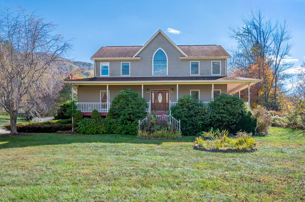 This is a must see home.  It has everything from a 24 foot vaulted ceiling to your own private library.  This home has some beautifully designed stain glass windows which allows radiant sunlight into the home.  You will enjoy the view of the valley from your wrap around porch. For anyone who enjoys the outdoors and nature this property joins the National Forest.  There is a metal building for projects and also a pole barn for horses or cattle.  The property boarders Hunting Camp Creek. You will have to see this property to appreciate all that it has to offer.