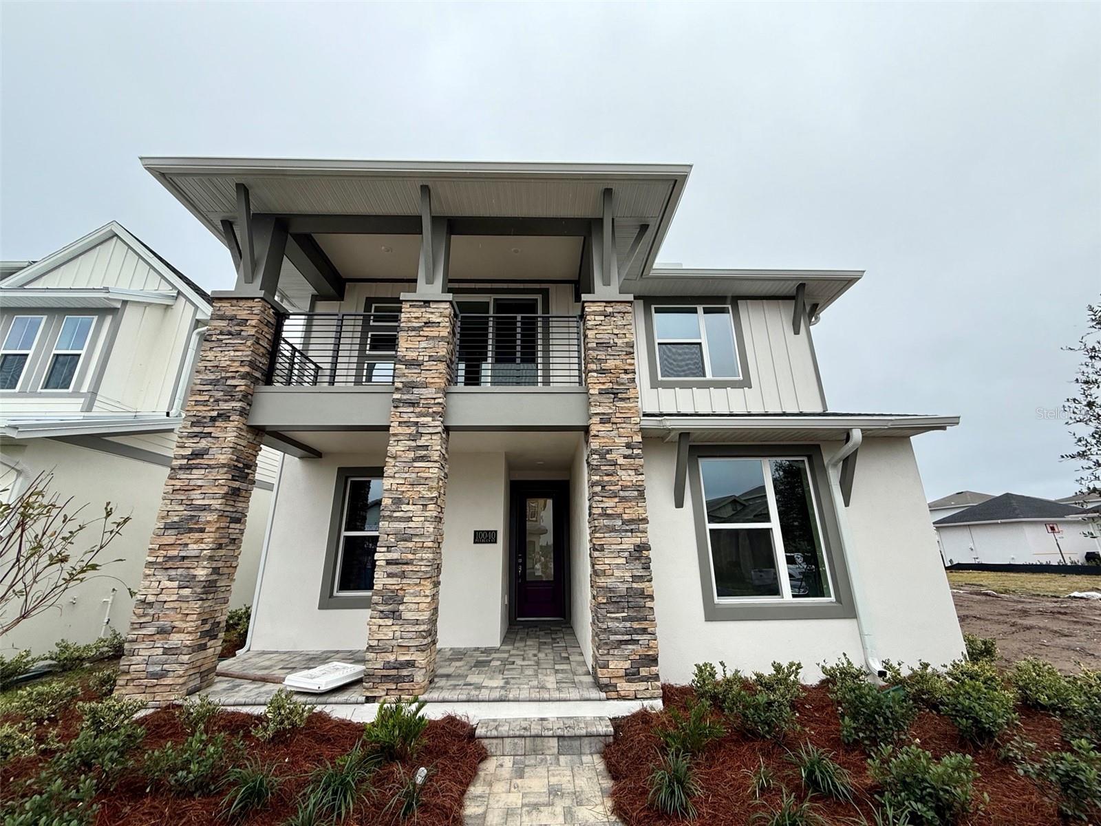 MOVE IN READY! The Maui by ICI Homes: Two-Story Perfection with a Side of Sunshine. Looking for a home that balances chill vibes, party-ready spaces, and practical design? Say aloha to The Maui, a smartly designed 2,472 sq. ft., two-story stunner that mixes comfort and style like a piña colada at golden hour. Walk through the door and boom, you’re welcomed by a 12’ CEILING OPEN CONCEPT LAYOUT where the living room, dining room, and kitchen flow like a well-rehearsed dance. Whether it’s taco night with the fam or a quiet Netflix-and-nap Sunday, this space has you covered. The kitchen is the heart of the home (and possibly your snack empire), featuring a center island, 42” SOFT CLOSE CABINETS, QUARTZ COUNTERTOPS, and enough space for all your gadgets and goodies. Chat with guests over coffee or unleash your inner chef, this kitchen’s up for anything. Indoor-Outdoor Living? Nailed It. Slide open those oversized glass doors and find yourself in your private covered lanai and breezeway, complete with a built-in summer kitchen that practically begs for burgers and mojitos. It’s the kind of Florida lifestyle dreams are made of and you’re living it. Your MAIN-FLOOR PRIMARY SUITE is tucked away like a VIP lounge, with a walk-in closet big enough for serious shopping habits and a spa-style bath with dual vanities and a walk-in shower you’ll want to stay in forever. There’s also a second bedroom and full bath downstairs—perfect for guests, grandparents, or your night owl teenager. Upstairs Fun Zone? Yes, please. Head upstairs to the spacious game room and let your imagination run wild—media room, art studio, home gym, Fortnite headquarters... you name it. Two additional bedrooms and a full bath give everyone their space, while the second-floor balcony offers front-row seats to the sights and energy of Laureate Park. Details That Take It Up a Notch include tile flooring throughout, tray ceilings & crown molding, Low-E high performance windows, Hybrid hot water heater, and 2-10 Builder’s Warranty for that sweet peace of mind. The Maui: Packed with personality, built for life, and made for Florida living at its best. Ready to make it yours? This one’s got your name (and your flip-flops) written all over it.