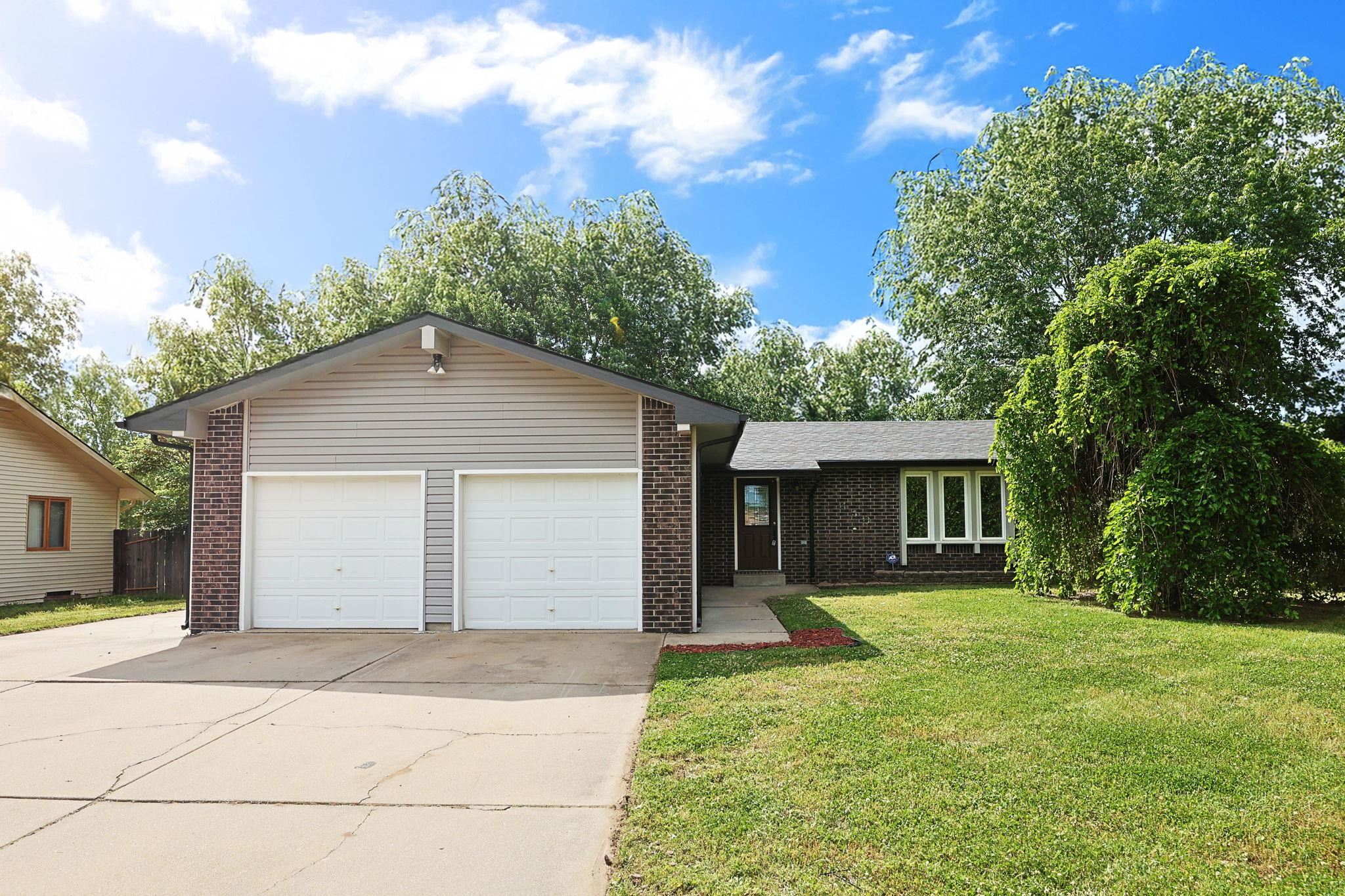 This stunning, updated ranch-style home in the heart of Haysville offers modern luxury with a comfortable, cozy feel. Impeccably updated, this home is designed for both relaxing family living and entertaining.  The kitchen features gorgeous granite countertops, striking new appliances, and ample cabinetry, offering a perfect blend of style and function.  The main bathroom has been completely transformed into a luxurious oasis, featuring a stunning tile shower and premium fixtures.  Downstairs, a huge, cozy family room awaits, complete with a charming fireplace perfect for movie nights.  The basement also boasts a 4th non-conforming room with a closet—perfect for a home office, gym, or guest room—plus a second full bathroom, maximizing the home's utility.  Set on a large lot with a two-car garage in a quiet neighborhood take advantage of the highly sought after Haysville schools.  Don't miss the opportunity to own this turn-key, stylish home!