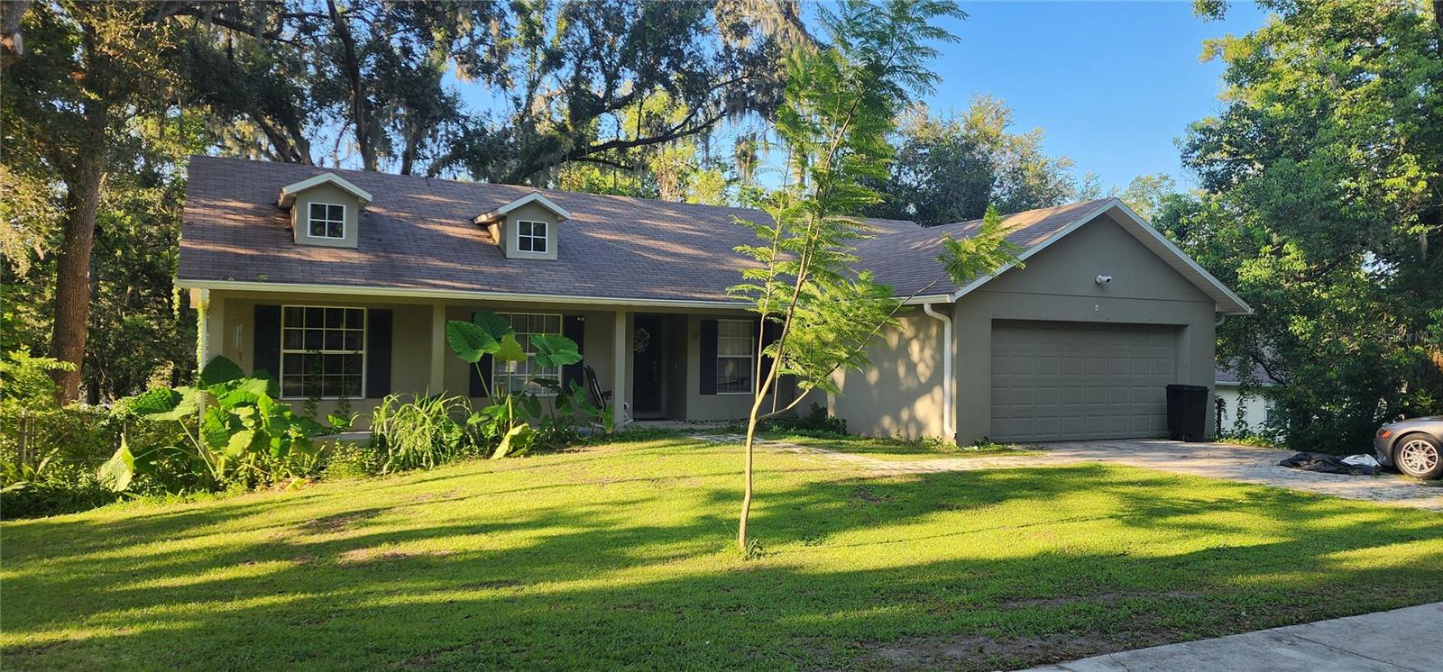 Discover the perfect blend of easy living and classic charm in this exceptional Brooksville home. The open, flowing layout and vaulted ceilings give a grand feel, creating a light and airy atmosphere that is both inviting and modern. This 4-bedroom, 2-bathroom home isn't just a place to live—it's a canvas for your best memories. 
Perched on a sprawling .4-acre lot, you'll have all the space you need to live, entertain, and create a personal oasis. The durable laminate and tile flooring throughout ensures a beautiful aesthetic with minimal upkeep. 
One of the most valuable features? There are no HOA or CDD fees, giving you the freedom to truly make this property your own. Set in a peaceful and friendly Brooksville neighborhood, you are moments away from excellent schools, local amenities, and easy commutes. This home is more than an address; it's a foundation for a beautiful life.