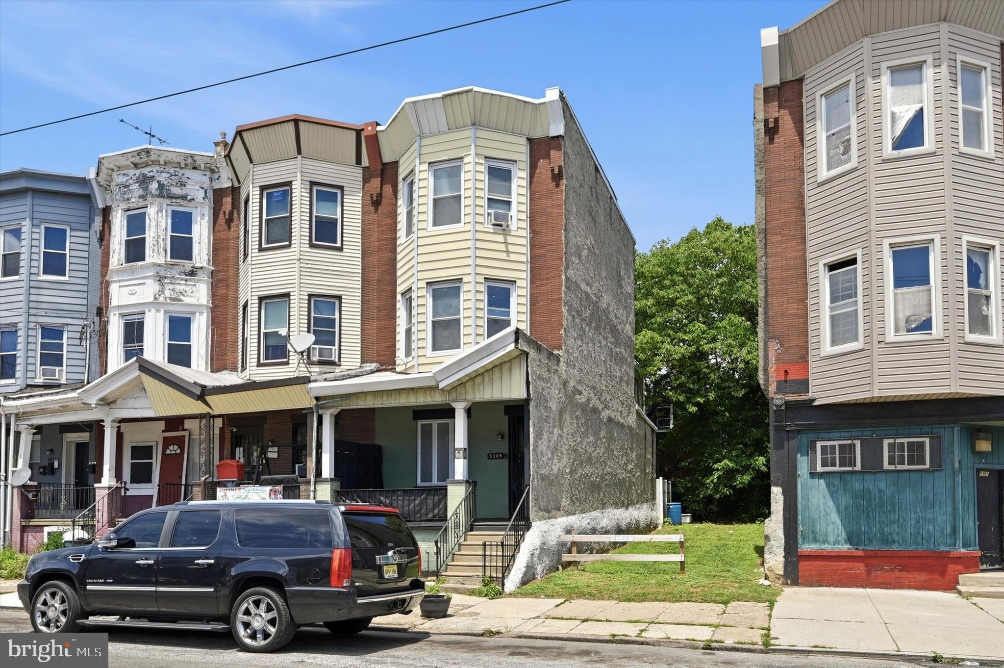 **5305 W GIRARD BRINGS UNIQUE, CLASSIC AND MODERN TOGETHER**If you have been looking for a home that has vast space and is unlike the others you see on the market, this is the one for you. Just waiting for that special new owner, the home welcomes you to 3 stories of bright windows, large rooms and a sense of delight from the moment you enter. Step up by your front garden plot to your classic Philly front porch. Hang lights, put chairs and watch the city life flow by. Once inside the first floor welcomes you with a spacious, open-concept layout with high ceilings. The large living room features a decorative white fireplace and mantle, which flows seamlessly into an equally generous dining room. Perfect for hosting, the dining area features crown molding and a built-in hutch for displaying your art, plants or books. As a bonus there is a convenient main-floor powder room for ease of daily life and guests. Beyond the dining room is the true standout. The kitchen is not only eat-in with built in bench and table seating, but it provides a unique experience for daily cooking and entertaining. A true space where conversations will flow effortlessly, everyone will gather around and where morning coffee and informal meals will feel like fun. The outside patio beyond the kitchen is also a good size and is clean and ready for your grill, table, chairs, plants and anything you envision for outdoor enjoyment. The second floor has 3 true sized bedrooms and a big hallway bath with original glass paneled door, vintage clawfoot tub/shower, vanity with deep sink and is outfitted for a perfect laundry station. Head on up to the third floor to find another 2 bedrooms that can be updated for the ultimate primary suite. The basement spans the entire home and is perfect for storage. It houses all the mechanicals. Located off of 52nd Street, the location, uniqueness, price, size and condition are irresistible. Schedule your showing today or call for a private tour.