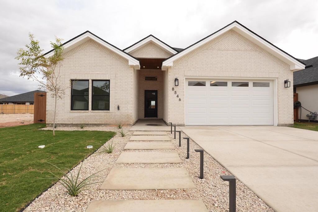 Stunning new construction offering 3 bedrooms, 2.5 baths and 1,913 sq ft with soaring ceilings throughout. Custom kitchen with quartz surfaces, stacked cabinetry, glass-front accents, low-voltage toe-kick lighting, walk-in pantry, 36” gas range, double oven and refrigerator—all included. Primary suite features a spa-inspired bath with double-head shower, lighted niche and custom closet with GE steam closet. Fireplace feature wall, mudroom, covered patio, outdoor kitchen, backyard turf and 2-car garage complete this beautifully designed home.