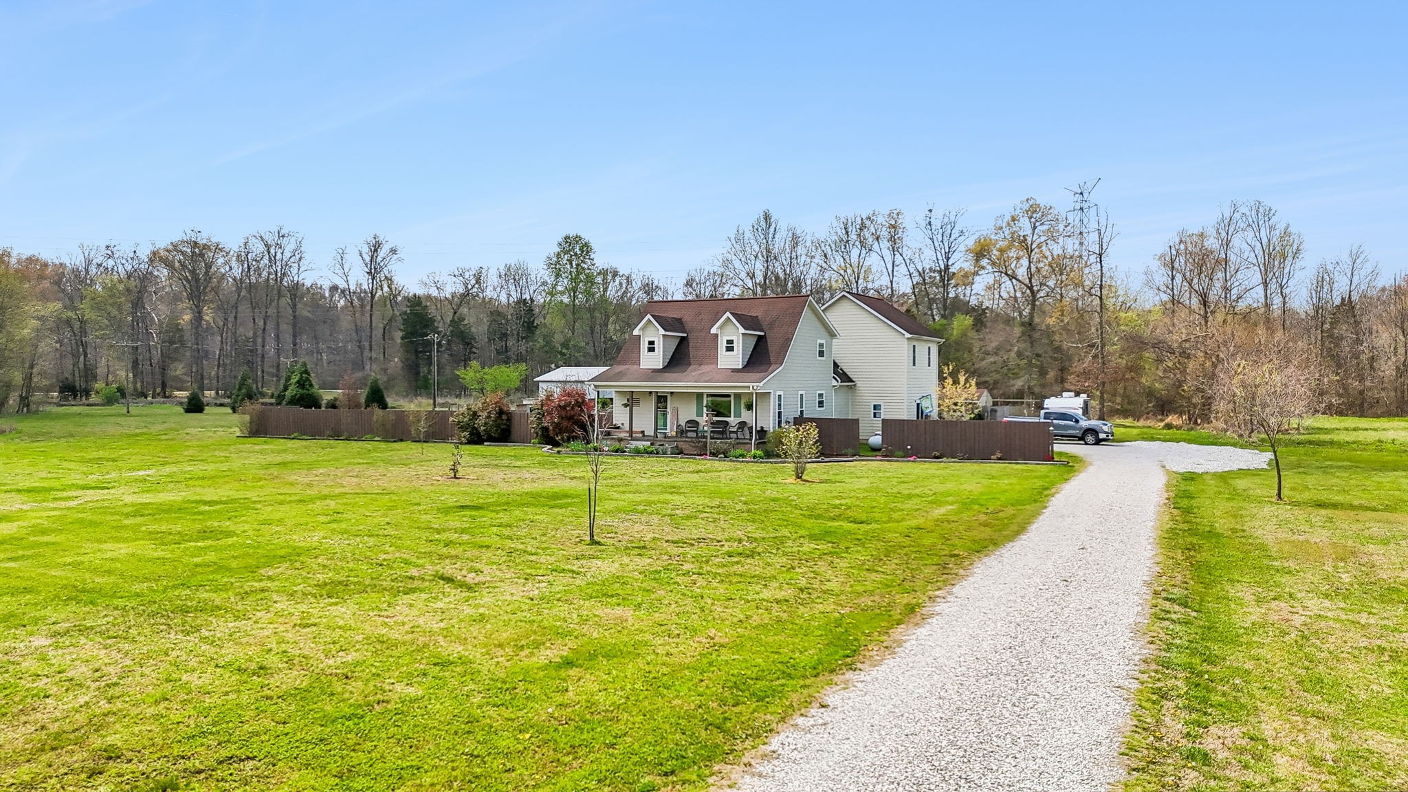 If you've been dreaming of wide-open spaces, fresh air, and a place to truly unwind...this is it. Nestled on approx. 21 sprawling acres this 3 bdr, 3 bath retreat offers the perfect blend of comfort, privacy, and country charm. Wake up to breathtaking mountain views, sip your coffee overlooking the peaceful creek and pond, and end your evenings surrounded by nothing but serenity. Barn is ready for hobbies, animals, or storage. She shed set up perfectly for guests or a private getaway, and for those hot TN summers you will enjoy the above ground pool. Sounds of the meandring creek create a setting that feels both peaceful and extraordinary.  Inside, the home offers a warm yet sophisticated atmosphere with spacious living area ideal for both entertaining or relaxing with family. Ideally located just minutes from Nissan and Hwy 64. This is more than a home it is a private sanctuary, where refined living meets the timeless beauty of the countryside. 2 car attached garage and so much more!  Wildlife galore for the hunter in the family!!