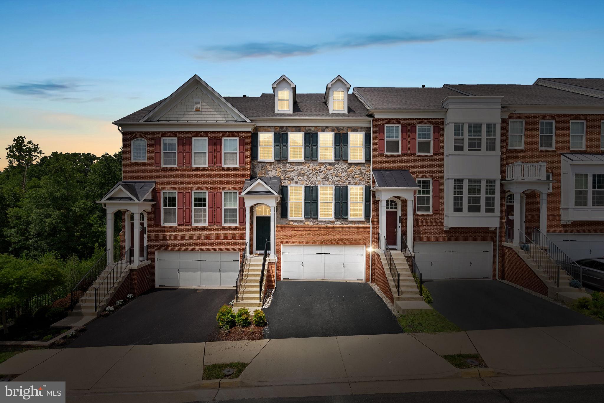 Welcome home to this beautifully maintained townhouse in sought after Goose Creek Village! A striking stone and brick front and 2 car front load garage offer immediate curb appeal, setting the tone for the space within.Inside, fresh paint throughout and new carpet give this home a crisp, move in ready feel, complemented by brand-new lighting fixtures. The main level features an eat in kitchen with an island and a bright Sun Room, perfect for morning coffee or casual entertaining.Upstairs, you'll find 3 spacious bedrooms and the convenience of bedroom level laundry, including the Primary Suite with a walk in closet, tray ceiling, sitting area, and private bathroom with a separate soaking tub and shower.The lower level offers a bedroom, full bathroom, Recreation Room with walkout access to a private patio, all backing to peaceful woods for a serene, no-rear-neighbor setting.Location is unbeatable: close to commuter routes, grocery stores, schools, restaurants, and shopping, with the Ashburn Metro less than 5 miles away and Dulles International Airport just 9 miles away, ideal for commuters and travelers alike.Don't miss this move-in-ready gem in one of the area's most convenient locations!