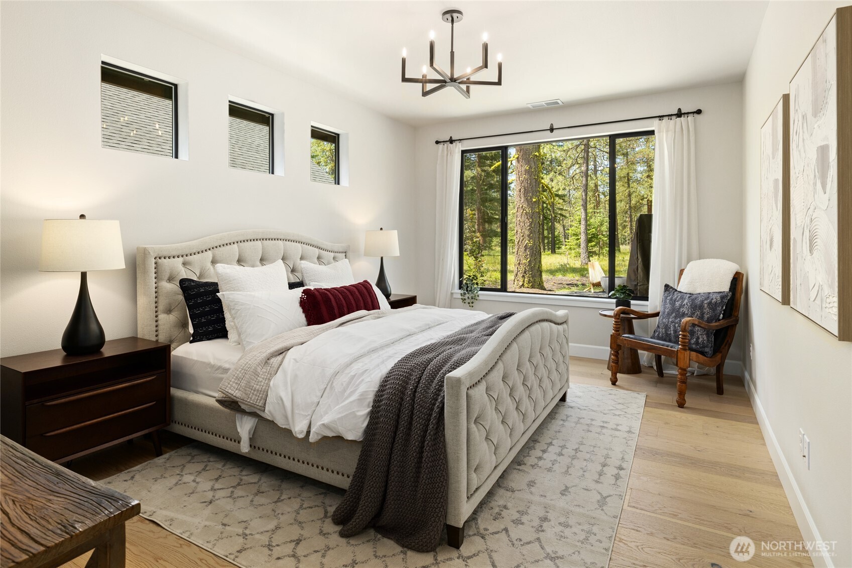 Primary bedroom with sliding glass door to the back patio and gas firepit.