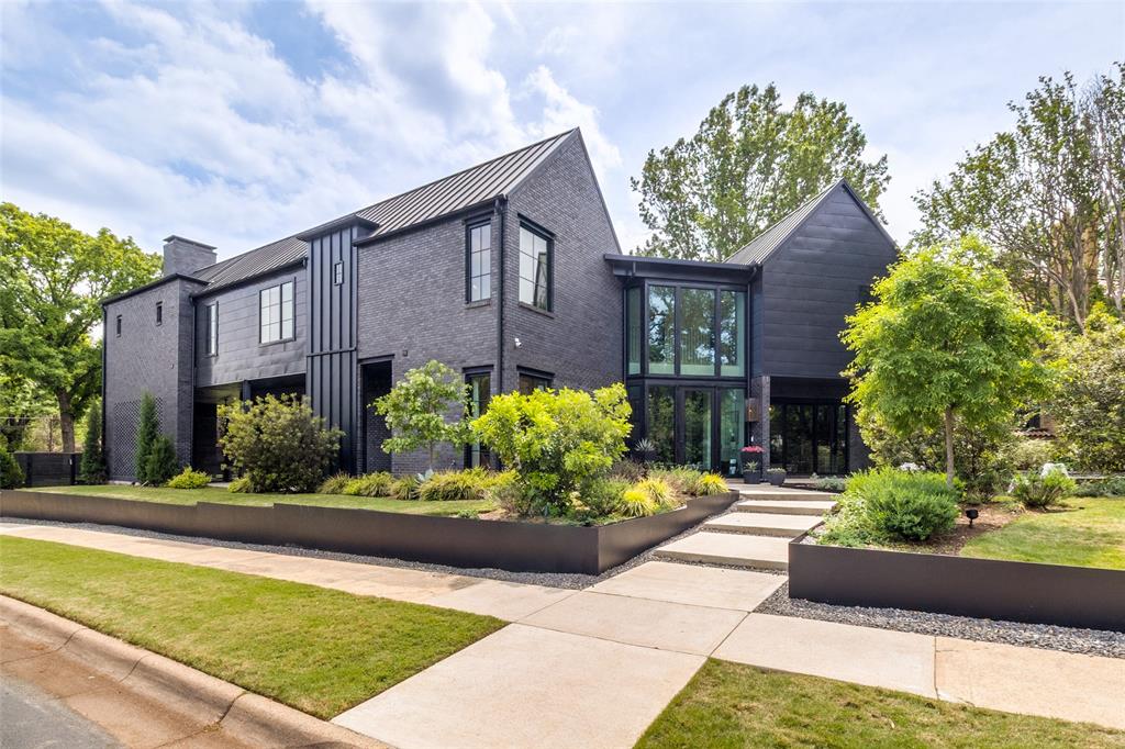 Thoughtfully envisioned & designed home blends elevated finishes with exceptional indoor-outdoor living. Upon arrival you’re welcomed by the beautifully curated landscape & courtyard seating area designed by David Rolston, setting the tone for the level of detail found throughout this incredible home. Complete with 4 bedrooms all with ensuite baths, multiple living areas, delightful vignettes, 2 luxurious powder baths, designer wallpaper, stunning Arteriors lighting, premium Buster & Punch switches & outlets, paired with timeless unlacquered brass hardware for a sophisticated, cohesive aesthetic. The bar offers unique area for entertaining, & is a true statement, showcasing real copper hardware plus a pink marble bar. LED-lit cabinet shelving adds both function & ambiance throughout the home. Designed for both everyday living & entertaining, the outdoor spaces are equally impressive seamlessly bringing the outdoor & interior spaces together as only an architect can do. Enjoy a resort style backyard complete with pool with chiller & heater, spa, outdoor fireplace & covered living & entertaining areas, & turfed yard with in-ground trampoline. A charming breezeway brick lounge area & front yard fire pit provide multiple spaces to relax & gather. Inside functionality meets luxury with open concept kitchen & living, with custom brass fluted backsplash, Dacor appliance package including 48' chef's range & vent, 48' built-in refrigeration, well thought out cabinetry & butlers' area with pantry. The kitchen opens to both primary living & dining space as well as cozy den or media room plus the family room & lounge with bar. This home offers great separation of space with 2 offices, one up & one down, plus a huge  game room up. This unique property offers rare combination of high design, well thought comfort & functionality, amazing details throughout, all minutes to downtown Dallas, blocks to White Rock Lake and Park, & award winning Lakewood Elementary!