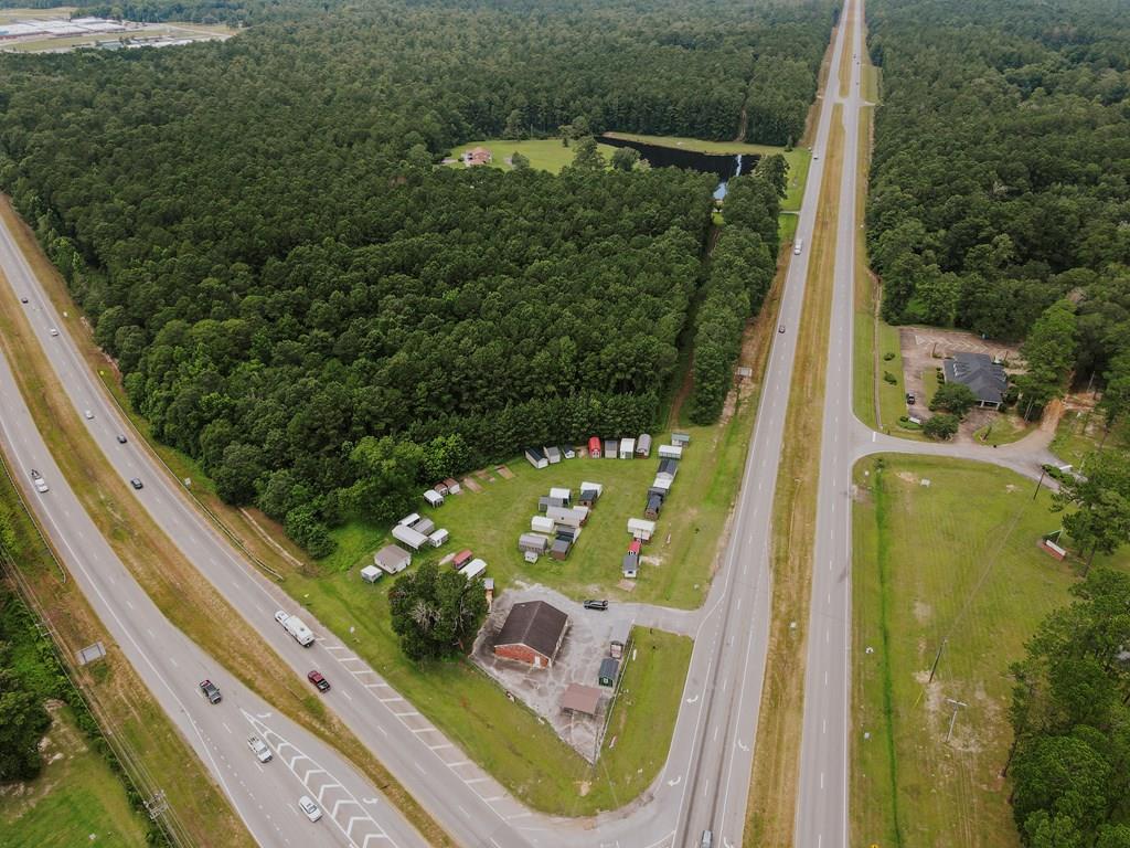 50+ acres at the intersection of US Hwy N and Hwy 84 by-pass in Thomasville, GA. 5.2 acre corner lot would be excellent commercial lot.  Remaining property great potential for commercial or residential development.  Plenty of  road frontage on both Hwy 19N and 84 by-pass.  Two houses on property are "out"