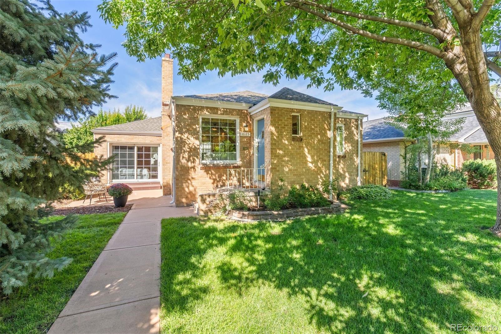 Classic Belcaro charm meets fresh, move-in-ready style in this beautifully updated 4-bedroom, 2-bath brick ranch. Set along a picturesque, tree-lined street on a mature lot, this light-filled home is full of character, warmth, and flexible spaces designed for everyday living and entertaining. The bright kitchen features granite countertops, modern subway tile, JennAir stainless steel appliances, and abundant natural light. Original woodwork, charming door trim, and exposed brick preserve the timeless character.  Three bedrooms are conveniently located on the main level, including a spacious primary retreat with a vaulted ceiling, skylight, private mini-split, and sliding glass doors that open to its own patio, creating the perfect spot for morning coffee or unwinding in the evening.  The finished basement adds exceptional versatility with an oversized family room, fourth bedroom, full bathroom, laundry room, and a bonus flex room ready for a home office, gym, or hobby room. Outside, the private backyard is made for Colorado living, with an oversized patio for al fresco dining and plenty of space to relax, play, and entertain. A spacious two-car garage with bonus loft storage and additional off-street parking adds even more functionality. With fresh paint, new carpet, and central air, this home is move-in ready and just minutes from the parks, shops, restaurants, and neighborhood favorites of Belcaro, Bonnie Brae, Wash Park, Cherry Creek, and Cory-Merrill.