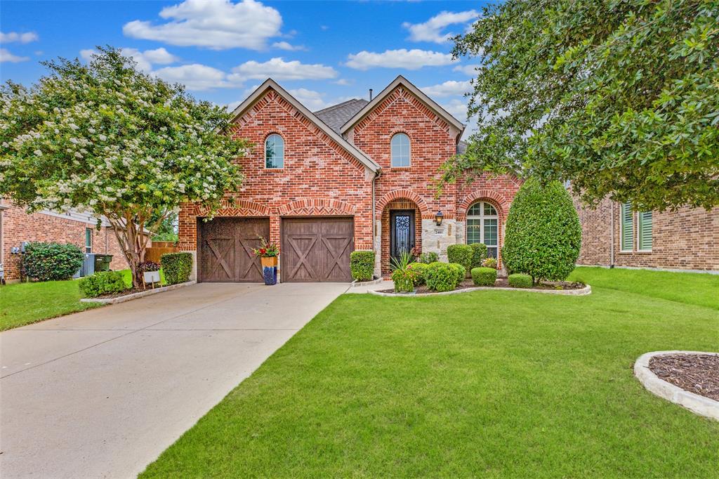 Step into elegance with this beautifully updated Highland Home, where high-end finishes and thoughtful details define every space. A striking custom iron and glass entry door opens to a grand foyer with exquisite marble herringbone tile and soaring ceilings, setting the tone for the upscale finishes and rich wood flooring that flow throughout the main level. The chef’s kitchen, completely refreshed in 2025, is a showstopper—featuring crisp white quartz countertops, classic subway tile backsplash, new vent hood, fresh floor tile, and designer lighting in the breakfast nook. Adjacent, the luxurious Primary Suite offers a spa-like retreat with a dramatic renovation that includes vertical ribbed wood-look tile, a freestanding soaking tub, oversized shower with bench seating, striking dark marble-look flooring, and modern dual vanities. The custom walk-in closet is finished in hardwood for a truly refined touch. A second downstairs bedroom, enclosed by French doors, currently serves as a stylish home office. The Family Room provides a warm, cozy feel with the stone fireplace. Upstairs, enjoy a spacious Game Room, 3 generously sized bedrooms—including one with a private ensuite—and a standout media experience. Step through a built-in dry bar with decorative tile and a beverage fridge—perfect for grabbing snacks or a chilled drink—then ascend into the elevated, fully outfitted Media Room, including the furniture. With a built-in projector, screen, and integrated speakers, it’s the ultimate space for cinematic evenings or game-day gatherings. Even the Utility Room boasts character with Moroccan-inspired floor tile and designer finishes. Ideally located with quick access to Central Expressway, this turnkey residence combines luxurious living with everyday convenience. Close to Oak Point Recreation Center and miles of biking trails!
