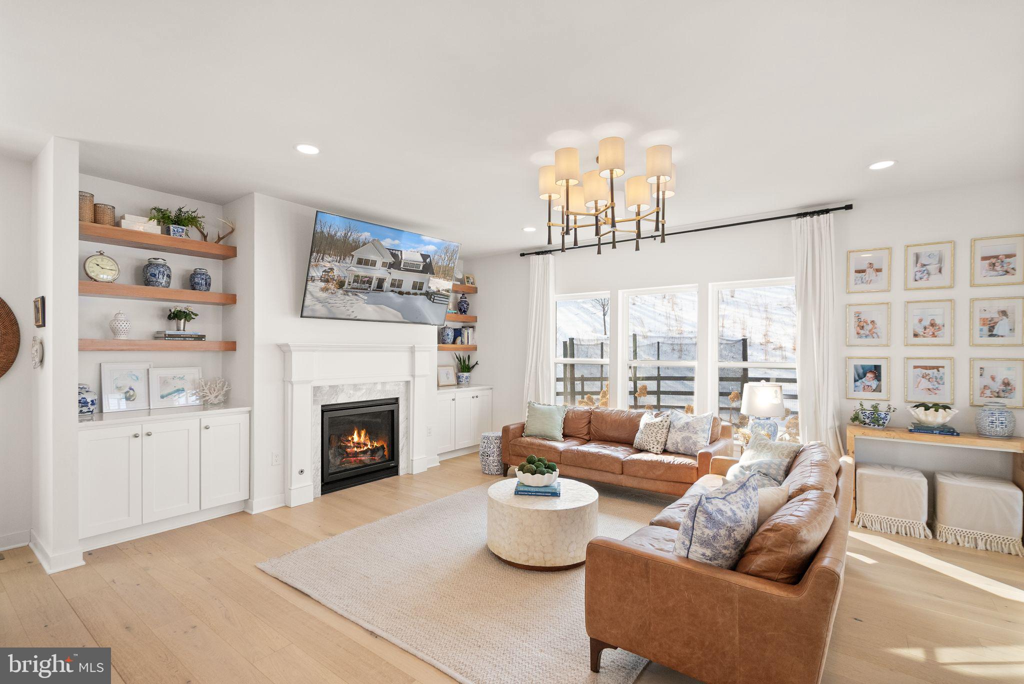 A private 10-acre Aldie estate thoughtfully curated and designed as a peaceful countryside retreat.Set across ten breathtaking acres with NO HOA, this extraordinary custom-built residence by MAC Builders offers the rare opportunity to experience refined estate living surrounded by nature. Mature trees, open skies, and sweeping views create an atmosphere of calm and privacy while the home reflects timeless craftsmanship and thoughtful design.Inside, a light-filled open floor plan unfolds with effortless elegance. The gourmet white kitchen, complemented by an expansive pantry and exceptional storage, flows seamlessly into the inviting family room anchored by a warm gas fireplace and the open dining area, creating a beautiful space for both everyday living and entertaining.A main-level bedroom with a full custom bath provides the perfect setting for guests, extended family, or multi-generational living. Just beyond the living spaces, a covered porch invites you to slow down and enjoy quiet mornings, peaceful evenings, and uninterrupted views of the surrounding countryside.Upstairs, the home offers four spacious bedrooms and three and a half baths, including a stunning primary suite designed as a private retreat. Wake to serene views and step directly onto your private upper-level deck overlooking the property. The spa-inspired primary bath features dual vanities, a freestanding soaking tub, a beautifully designed custom shower, and an impressive wrap-around walk-in closet. An upper-level laundry room adds everyday convenience.The walk-up lower level expands the home’s lifestyle offerings with a large recreation area, custom bar, an additional bedroom, and a full bath, along with a custom-built playroom designed to inspire fun for all ages.Outside, the property continues to impress with a fully fenced front yard, two-car garage, and a custom-built shed that can serve as a secondary garage, workshop, or additional storage space. The outdoor playset conveys with the home, adding another wonderful feature to the expansive outdoor setting.Served by private well and septic, this remarkable property offers the rare combination of acreage, privacy, and modern luxury while remaining just minutes from Aldie, shopping, dining, commuter routes, and the best of Loudoun County living.A truly special Northern Virginia countryside estate where every sunrise feels peaceful, every gathering feels special, and every day feels like coming home.