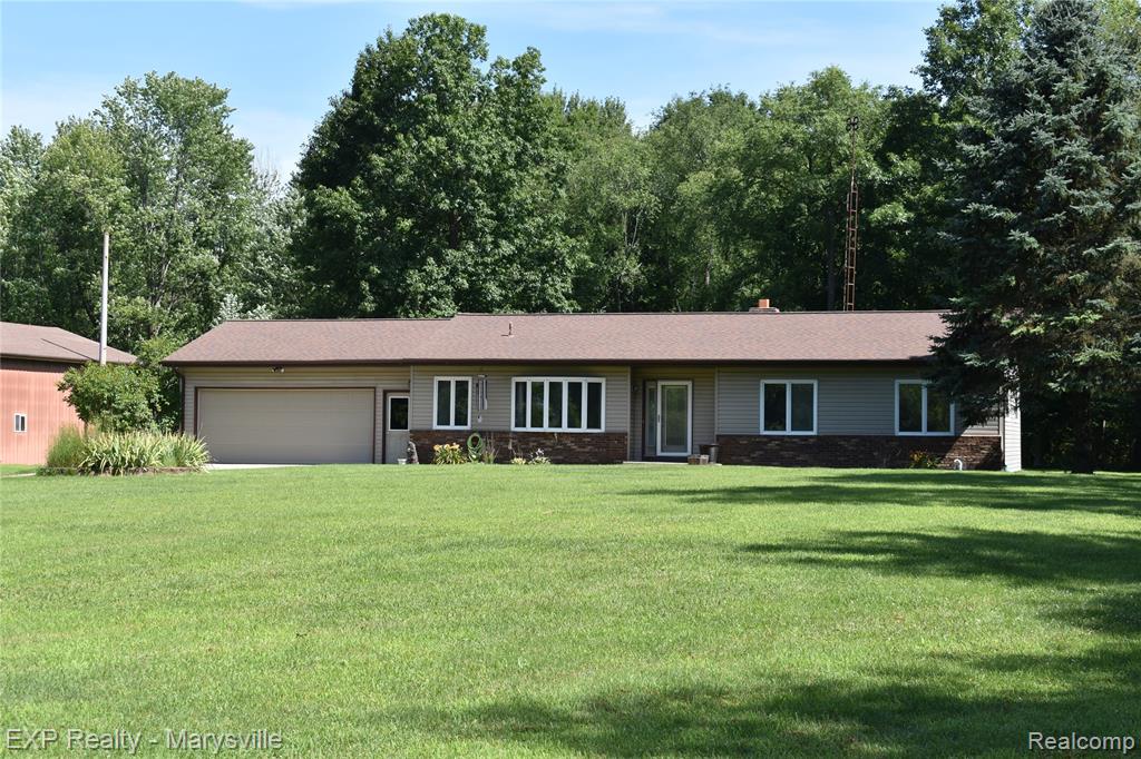 Welcome to 12980 Metcalf Road, a charming single-family home nestled in the country near Yale, Michigan.  Nestled on 40 acres, this home offers a delightful blend of comfort, character, and countryside appeal. This 3 bedroom home offers nearly 1600 square feet of well-designed living space on a spacious lot surrounded by natural beauty. Open-concept living and dining areas perfect for gatherings and seasonal decor.  You will love the vaulted ceilings in the living and kitchen areas.  Quality throughout with Anderson Windows, solid wood doors and granite bathroom countertops.  Adjoining dining room captures morning light and views of the backyard—great for relaxed or formal meals.
Bright family room with large windows and backyard views, ideal for daily lounging, entertaining guests and enjoying the abundant wildlife.  Trails cut throughout the 40, great for exploring, riding the ATV and hunting.  Deer, turkey and other wildlife are plenty.  Long secluded driveway for privacy.  Private backyard featuring a large deck—perfect for dining, summer barbecues, or tranquil morning coffee.  Enjoy throwing a line out in the large yard pond.  Attached 2 car garage offers plenty of space for vehicles or seasonal storage.  32x56 Insulated and heated pole barn with large front door.  Insulated 14x14 storage shed.  Central air conditioning & forced-air heating, keeping the home cozy year-round.  Enjoy the peace of knowing your covered in storms with a whole house generator.  Located in Yale’s serene rural setting, your commute offers scenic drives along tree-lined roads.  Near local parks, excellent schools, and community amenities—yet just a short drive to highway for easy access.  Historic downtown Yale is nearby, offering charming shops, dining options, and seasonal events.