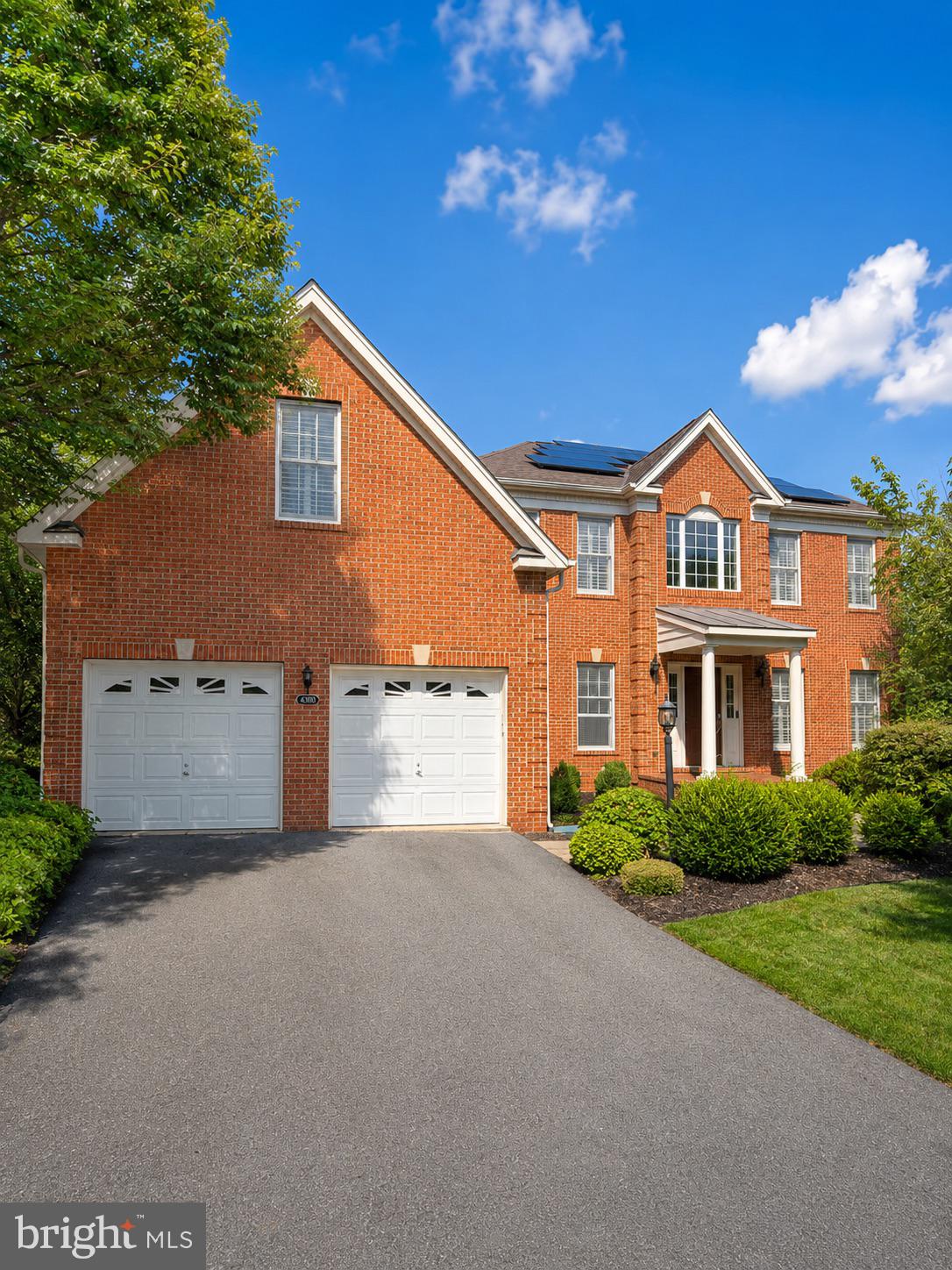 Stunning brick-front Colonial located on a quiet cul-de-sac in sought-after Loudoun Valley Estates. Situated on a private 0.33-acre lot backing to woods, this exceptional home offers over 5,200 square feet of living space with 5 bedrooms and 4.5 bathrooms.The main level features a two-story high foyer, formal living and dining rooms, a spacious office that can also serve as a bedroom, a bright sunroom overlooking the backyard, a two-story family room with a gas fireplace, and a gourmet kitchen with granite countertops, stainless steel appliances, center island, and breakfast area.Upstairs, you'll find a luxurious primary suite with a spa-like bath, along with three additional bedrooms and three full bathrooms. The finished walkout basement includes a large recreation room, fifth bedroom, full bath, and finished storage area.On the lower level, the fully finished walkout basement provides excellent additional living space, featuring a large recreation room, a spacious bedroom, a full bathroom, and a separate finished storage room. Walk out directly to the backyard patio and enjoy the peaceful backyard setting.Enjoy outdoor living on the large deck with stairs leading to the backyard and a patio accessible from the walkout basement. Recent updates include a new roof (2022), HVAC (2023), and water heater (2023). The home also features solar panels that will be fully paid off before closing.Additional highlights include hardwood floors, cherry cabinets, plantation shutters, sprinkler system, and an oversized two-car garage. Conveniently located near community amenities, major commuter routes, shopping, dining, and Dulles Airport.A beautifully maintained, move-in ready home offering space, privacy, and modern updates.