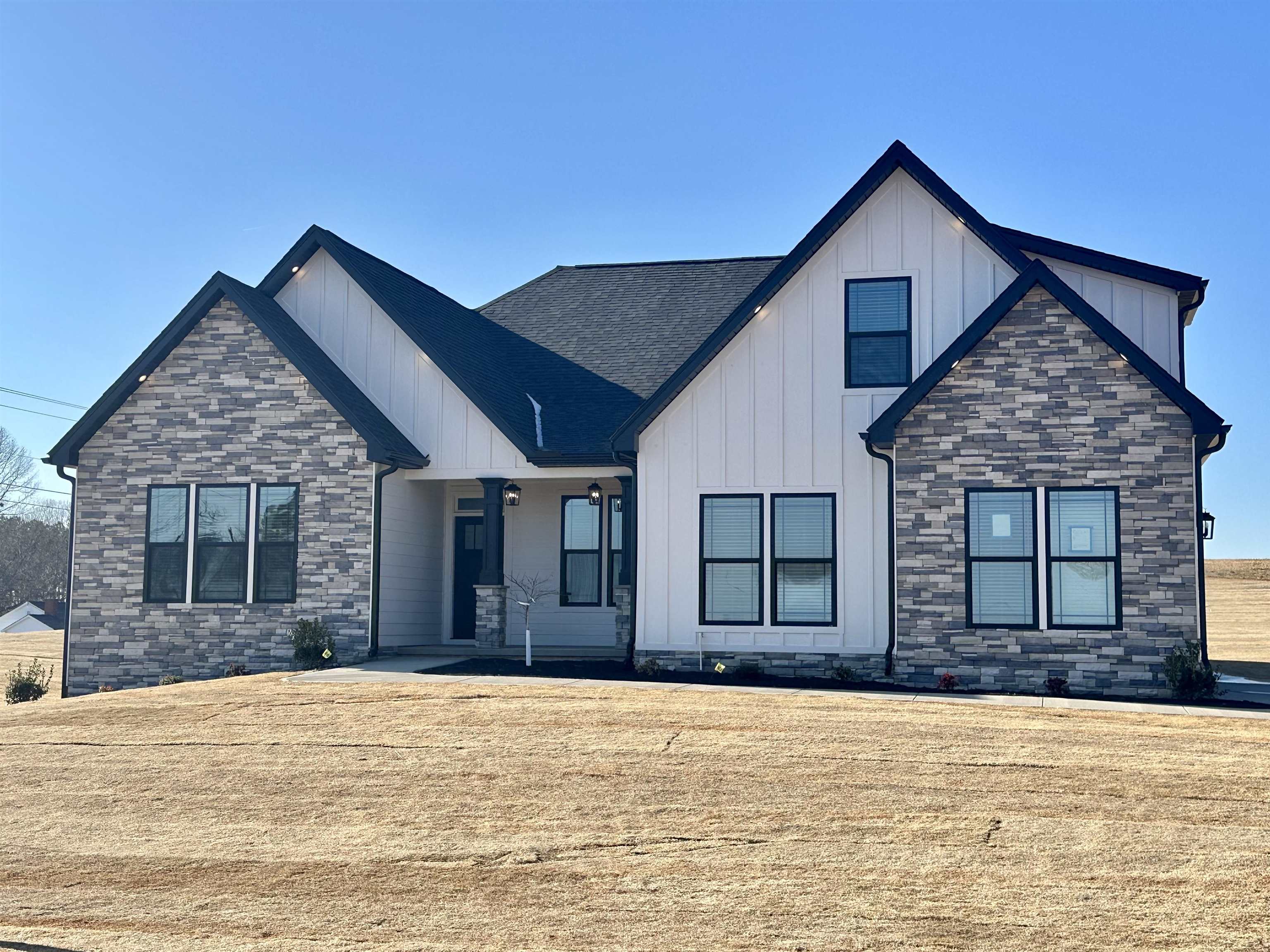 Custom home by local builder on 1.5 acres in Columbus/Greene Creek area! Enchanted Homes' Elite Series. Countless upgrades included. Wall ovens, Upgraded Flooring, Tile Shower w/Frameless Glass Door, Stone Work. Finished Room Above Garage with Bump Out Dormer for extra space. Beautiful views through Living Room, Master and back patio. Extensive trim work and site built columns. Scheduled to be complete around September 2025. The Beumont Elite with site specific customizations. Must See!