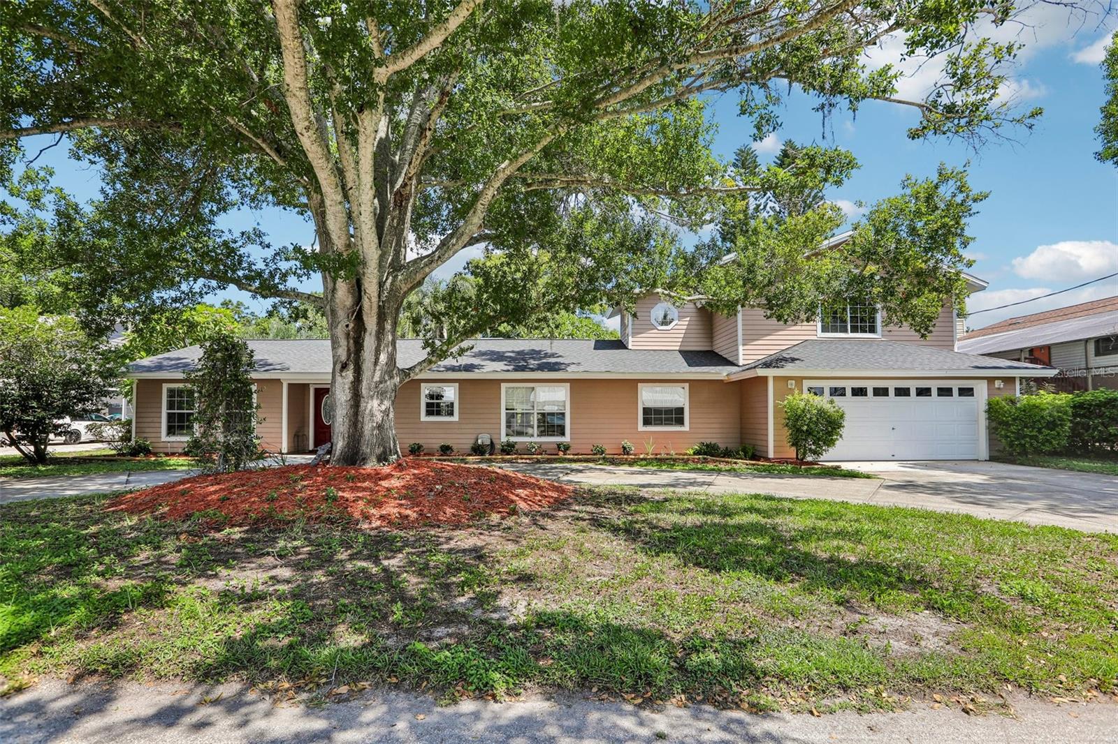 WELCOME TO YOUR ULTIMATE LAKE TARPON RETREAT! Tucked away on a quarter-acre lot in desirable Lake Tarpon Estates, this exceptional 3,354-square-foot heated pool home offers the perfect combination of spacious living, privacy, and waterfront lifestyle. With approximately 100 feet of freshwater canal frontage, direct access to Lake Tarpon, and a covered 10,000-pound boat lift, you can be out on the open lake in minutes.The flexible split-bedroom floor plan features a private first-floor in-law suite with its own bedroom, full bathroom, kitchen area, and private entrance—ideal for guests, extended family, multigenerational living, or a private retreat. Upstairs, you'll find two additional bedrooms, an updated full bathroom, a second living area, and a screened balcony with stairs leading directly to the pool.Outdoor living is exceptional, with more than 1,900 square feet of screened outdoor living space surrounding the heated pool and overlooking the peaceful waterfront. Whether you're entertaining, relaxing poolside, enjoying morning coffee, or watching spectacular Florida sunsets, this home was designed to embrace the waterfront lifestyle.The covered boat lift accommodates a boat up to approximately 28 feet and 10,000 pounds, providing convenient access to Lake Tarpon for boating, fishing, and water recreation.Recent updates provide added peace of mind, including a roof approximately 4 years old, new flooring, updated bathrooms, Jacuzzi tub, new water heater, new washing machine, new garage door opener, and recently serviced dual central A/C systems.Best of all, there is NO HOA! Bring your boat, RV, and water toys and start enjoying the Palm Harbor waterfront lifestyle today.