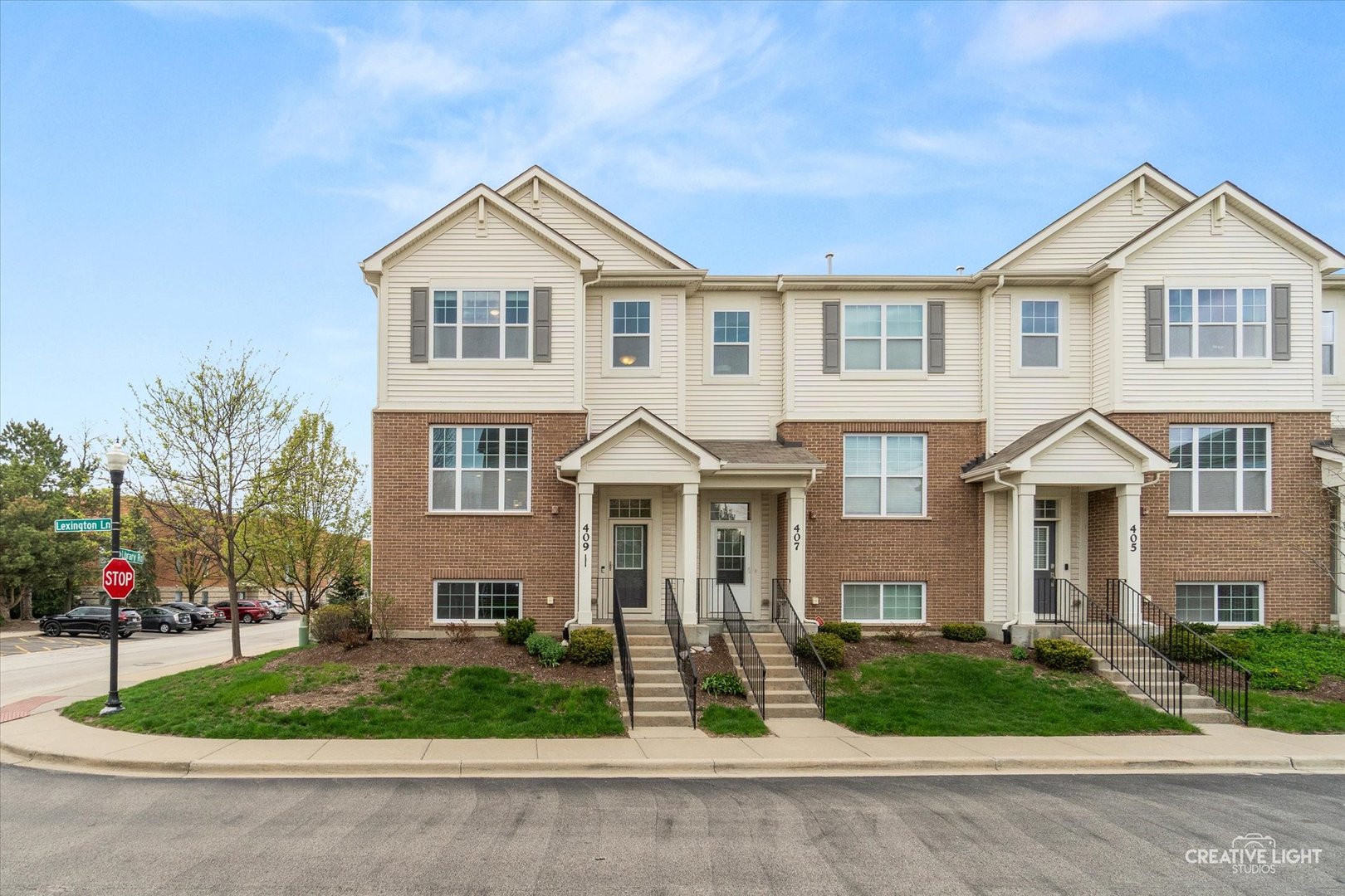 Welcome to Lexington Crossing and this beautiful end-unit townhome which is full of natural light and tucked into a quiet, desirable location. The main level has an easy, open flow that starts in the kitchen with 42" cabinets, a center island with breakfast bar, pantry for extra storage, stainless steel appliances updated in 2023, a glass tile backsplash, and granite countertops. Hardwood floors carry through into the dining area and spacious family room, where a gas fireplace adds a cozy touch, along with a convenient powder room nearby. Upstairs, the primary suite feels bright and open with its vaulted ceiling, walk-in closet, and private bath featuring dual sinks and a walk-in shower. You'll also find two more generously sized bedrooms, a second full bath, and a laundry room that makes everyday living just a little easier. The finished English basement adds even more flexibility with an extra space that works perfectly as a home office, workout area, or even a fourth bedroom. There's no shortage of extras here either, including an oversized private balcony, crown molding, 9-foot ceilings, Anderson windows, a 200 AMP electrical panel, newer blinds, and added recessed lighting throughout. The attached two-car garage features an epoxy floor and built-in shelving for plenty of storage. The location really ties it all together, with the library less than a block away and quick access to the Metra station, Woodfield Mall, Kimball Hill Park, North Salk Park, and the Lexington Woods Trail, so you're never far from shopping, commuting, or enjoying the outdoors.