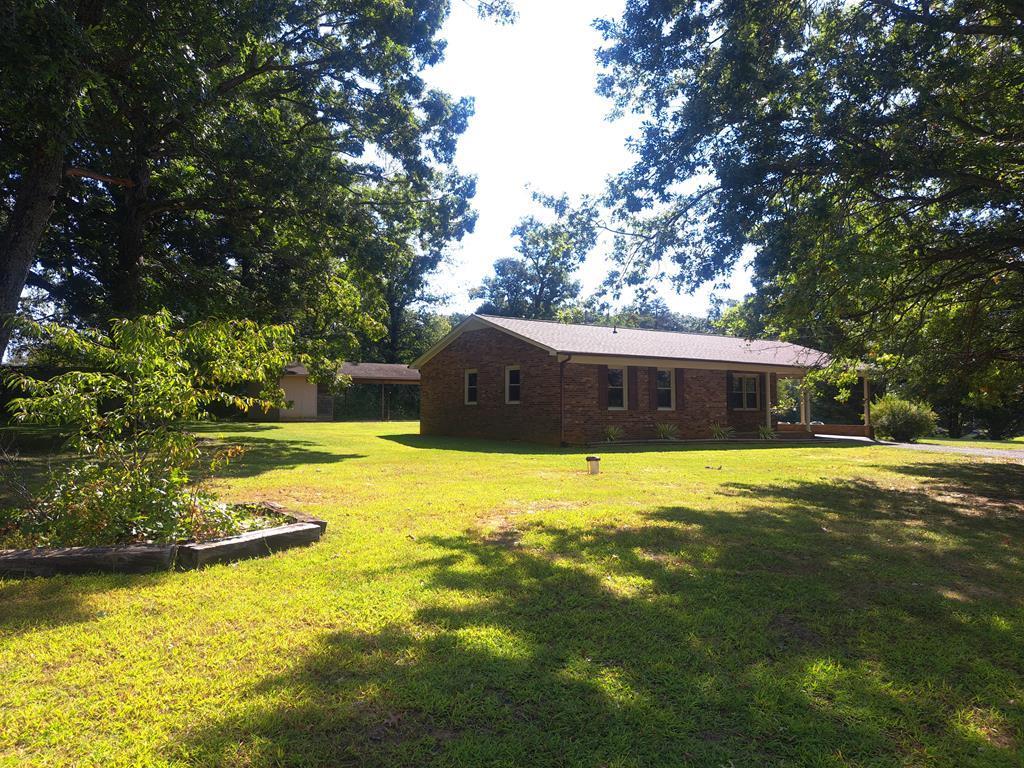 ( What A Gem ) 3 BR 2 BA Brick House with 1.09 +or- Acres Nestle in the Foothills Of The Blue Ridge Mountains. Has an Attached Carport and a Detached Shelter . Also their is a few old buildings Encroaching on the property line.( Don't Let This One Get A Way )